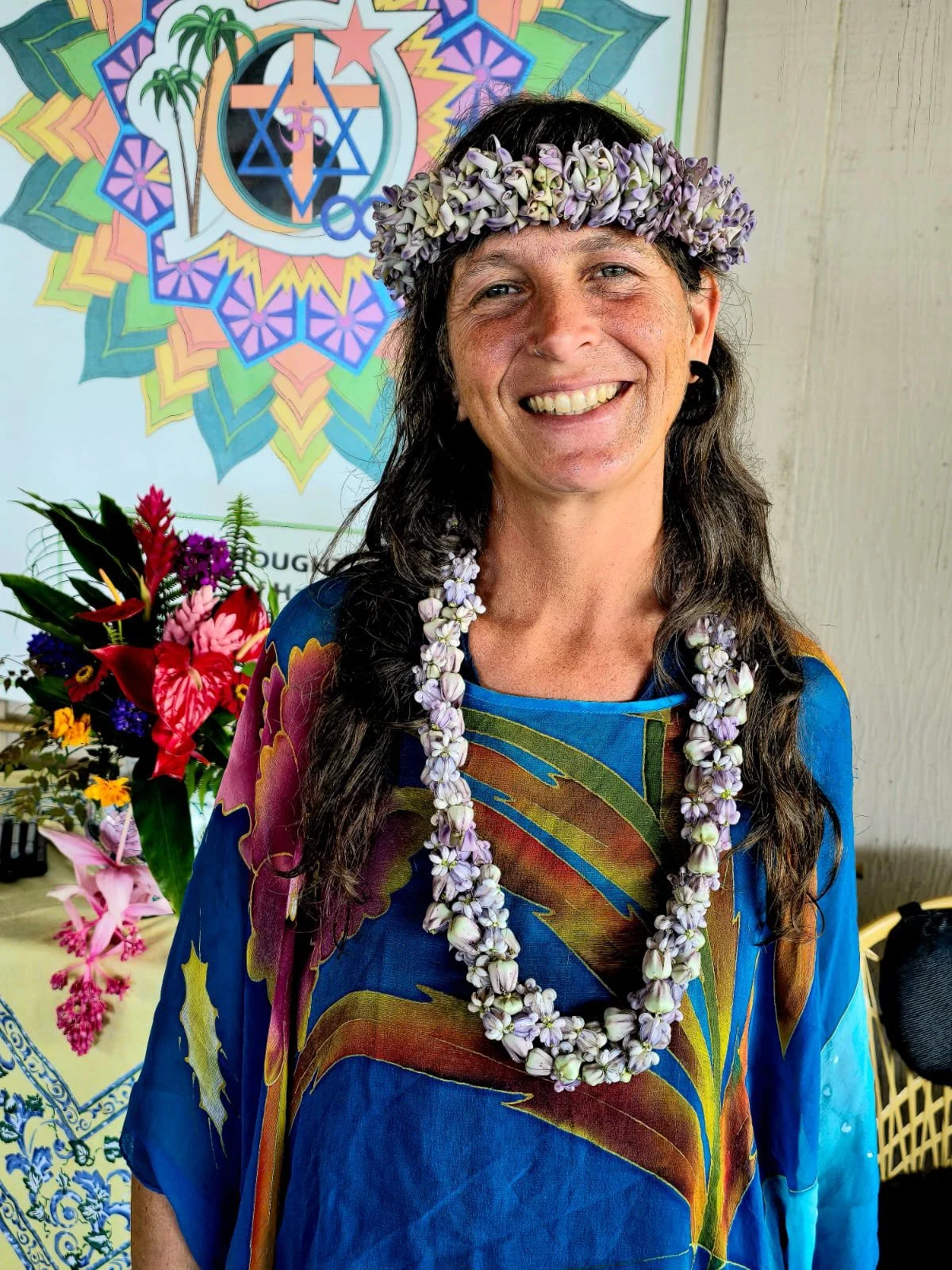 Member wearing flower lei celebrating at New Thought Center of Hawaiʻi in Kealakekua