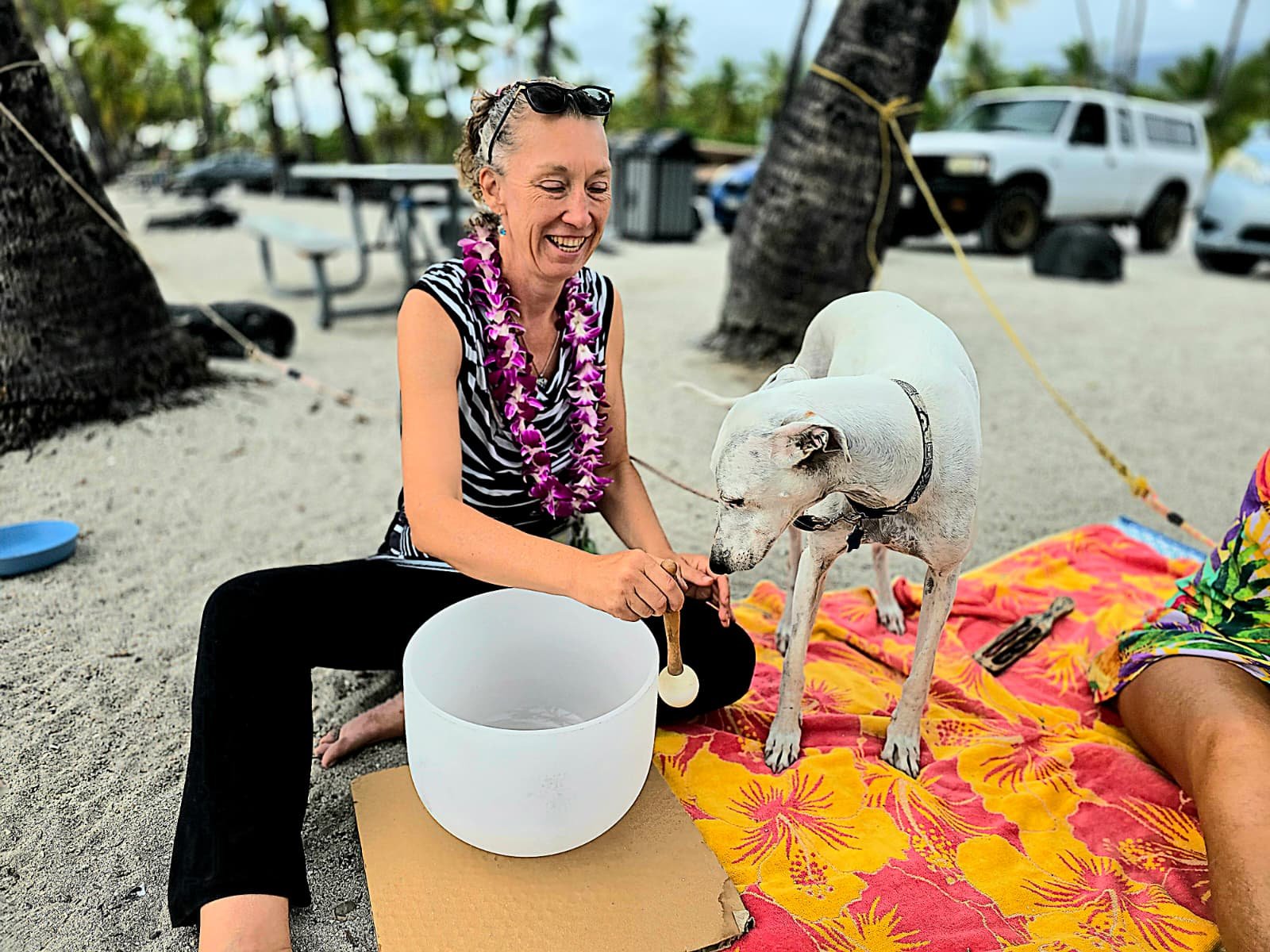 Photo of New Thought member at the beach with her dog