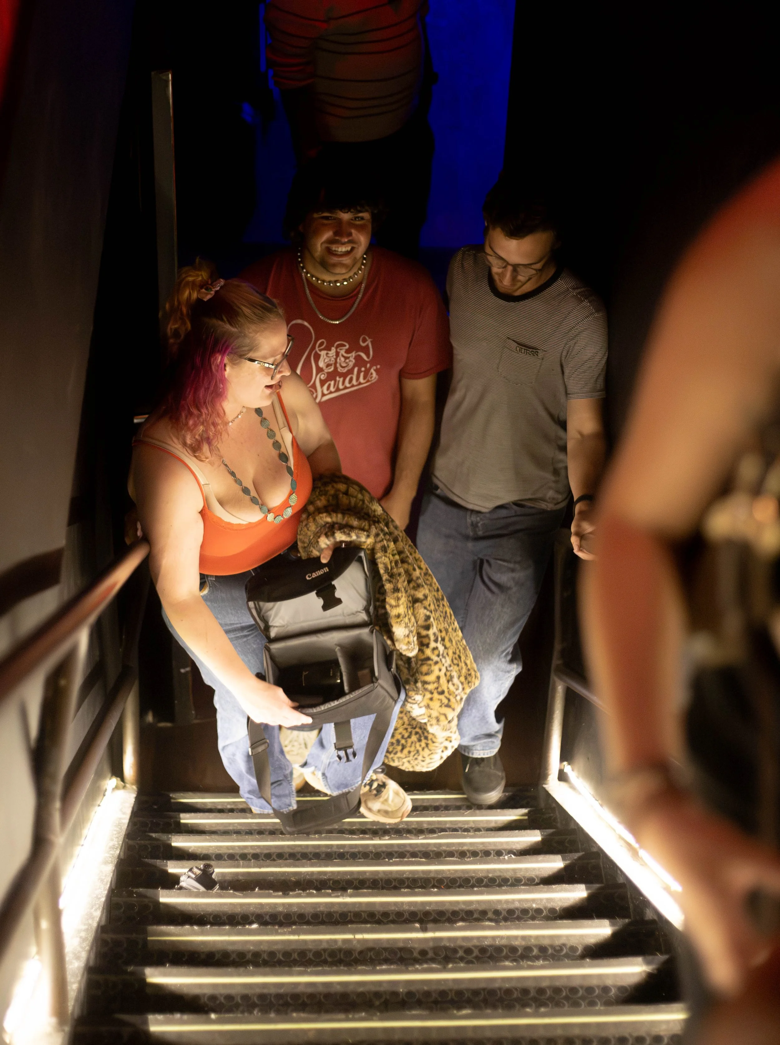 Melanie Maciejak laughing with other roadies as they exit Bowery Palace after a Killer Set from Deanna Valentine Music on August 11, 2026.