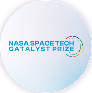 The NASA Space Tech Catalyst Prize logo, a white circle with "NASA Space Tech Catalyst Prize" in blue text in the middle.