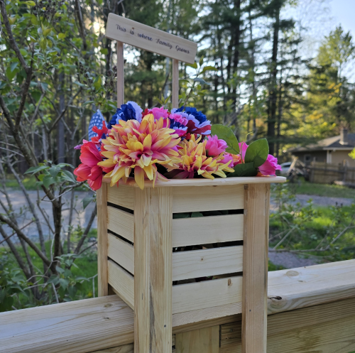Planter on railing with flowers and custom plaque web ready.png