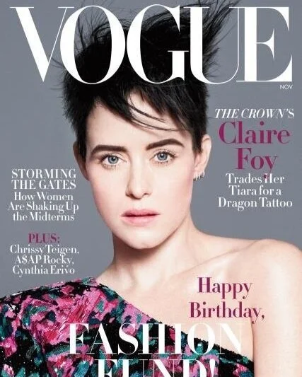 Vogue magazine cover featuring Claire Foy with short dark hair and wearing a colorful patterned top, celebrating her birthday.