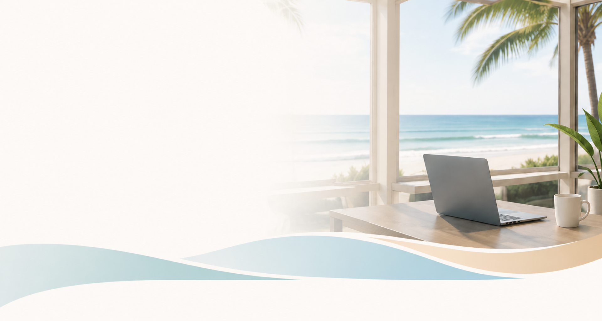 A workspace with a laptop, a white mug, and a potted plant on a wooden table, overlooking the beach and ocean through large windows with palm trees outside.