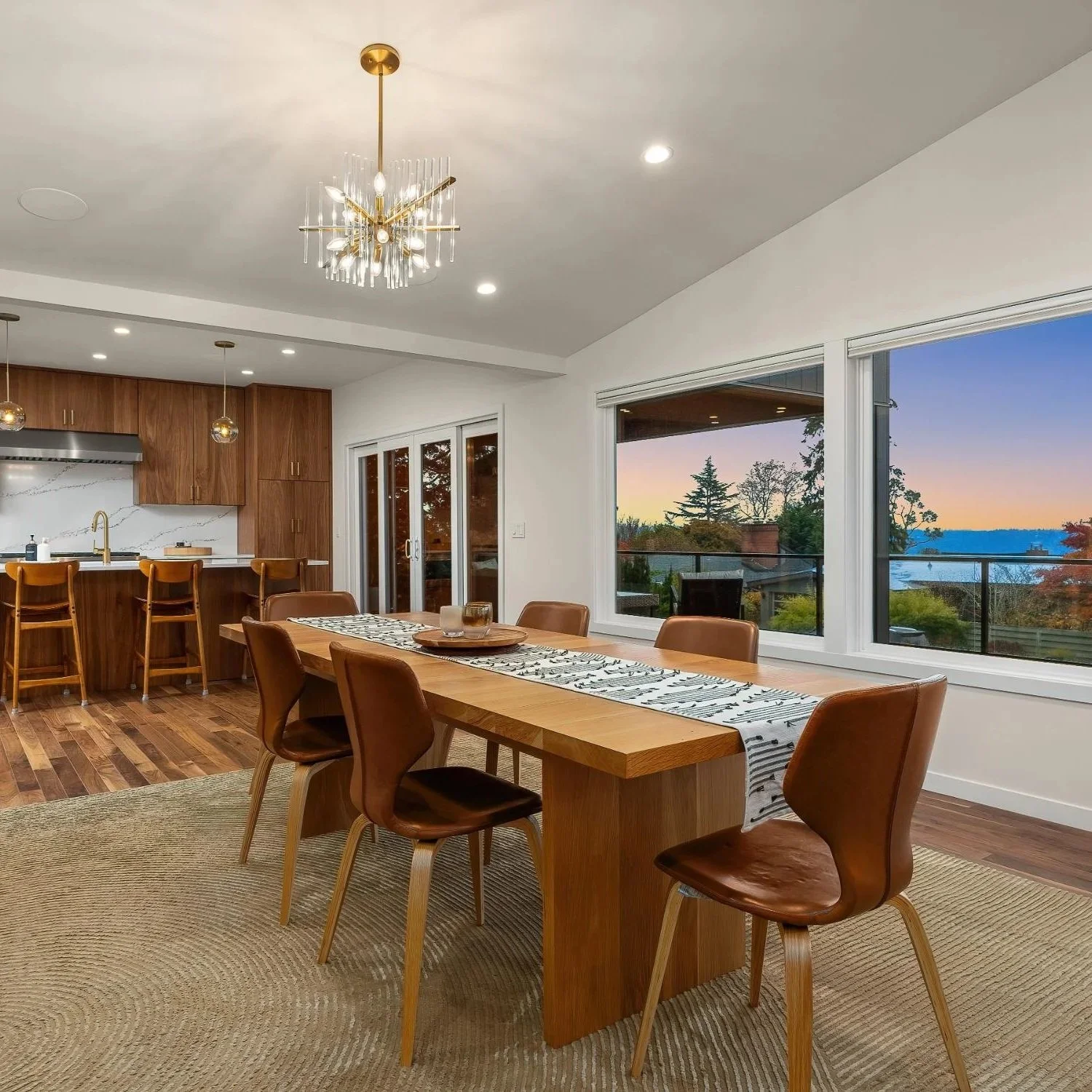 Mid-century modern open kitchen and dining room with table