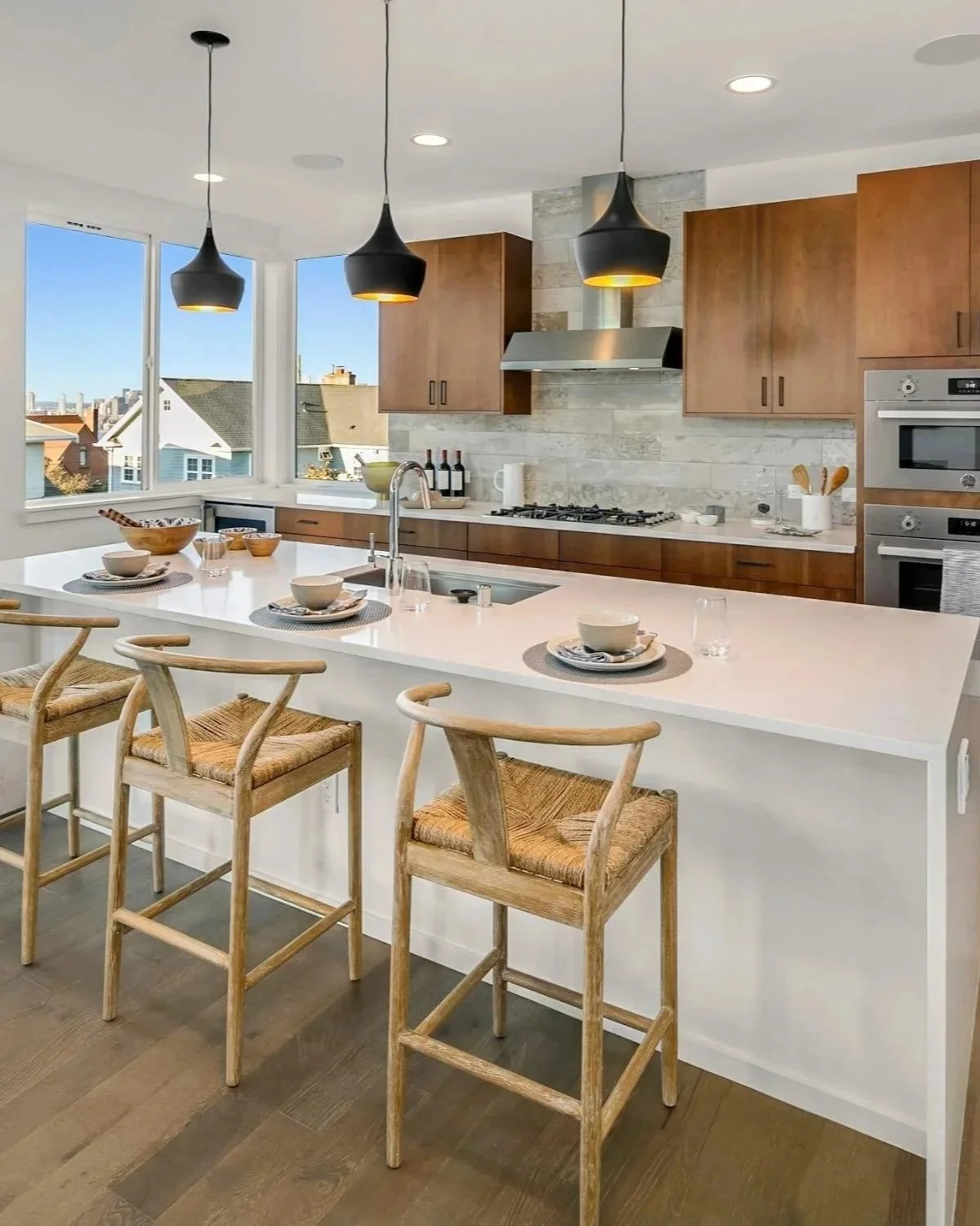 Modern open white and wood kitchen with view