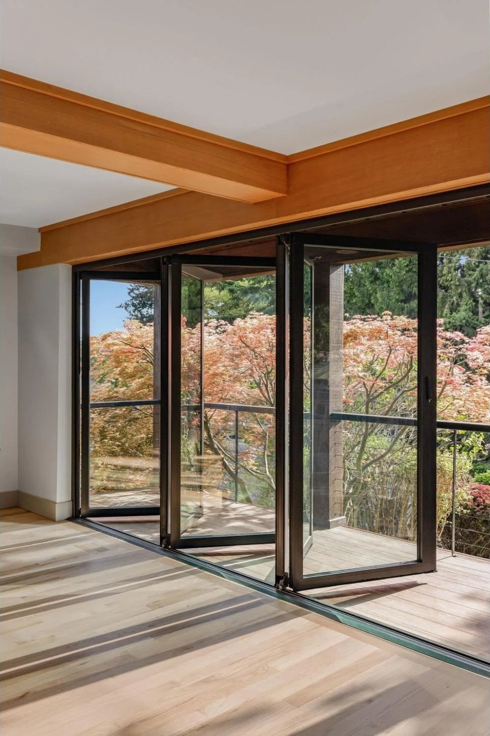 NanoWall addition with living room opening up to deck