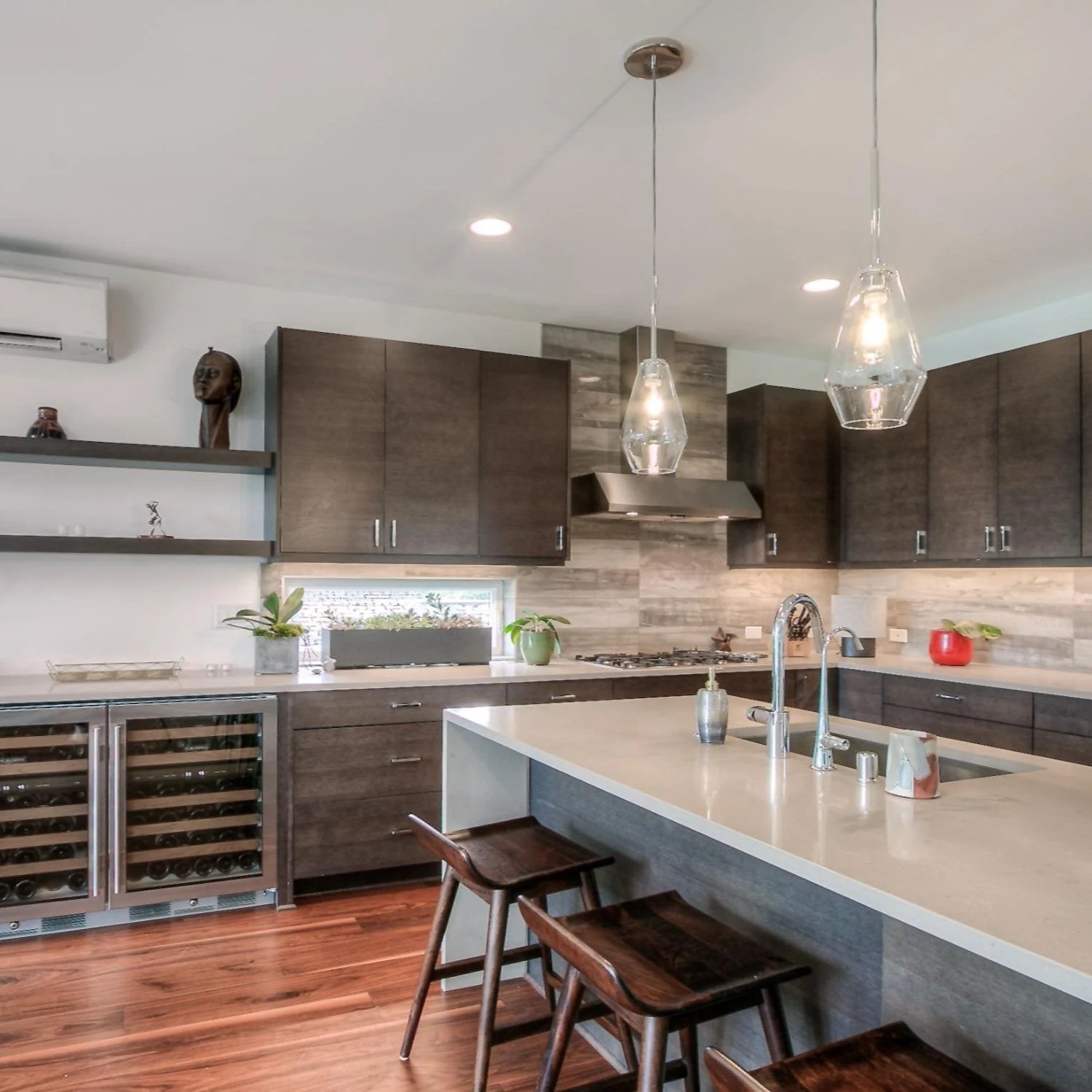 Open, custom kitchen on a new home construction project with wine storage