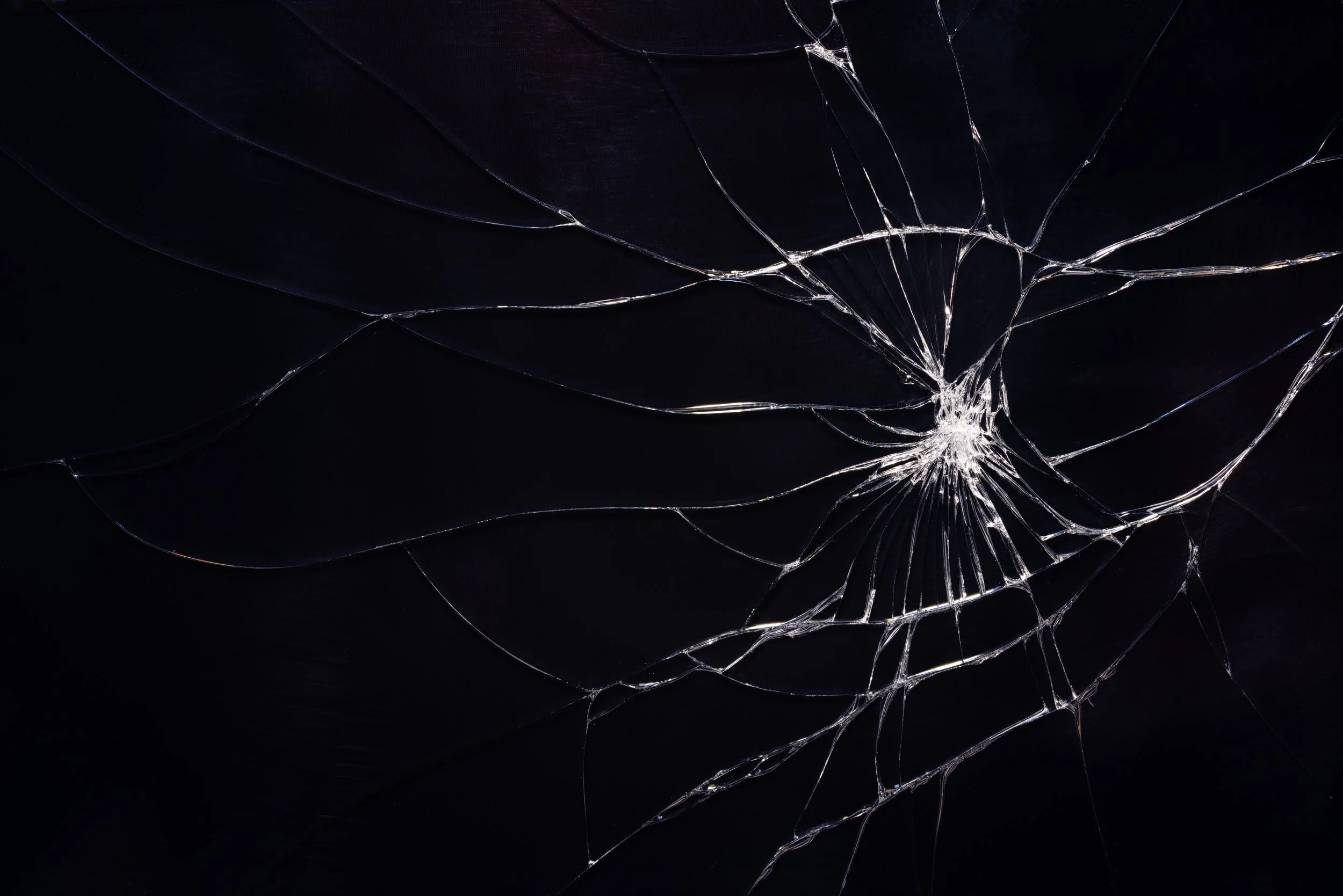cracked glass on black void background