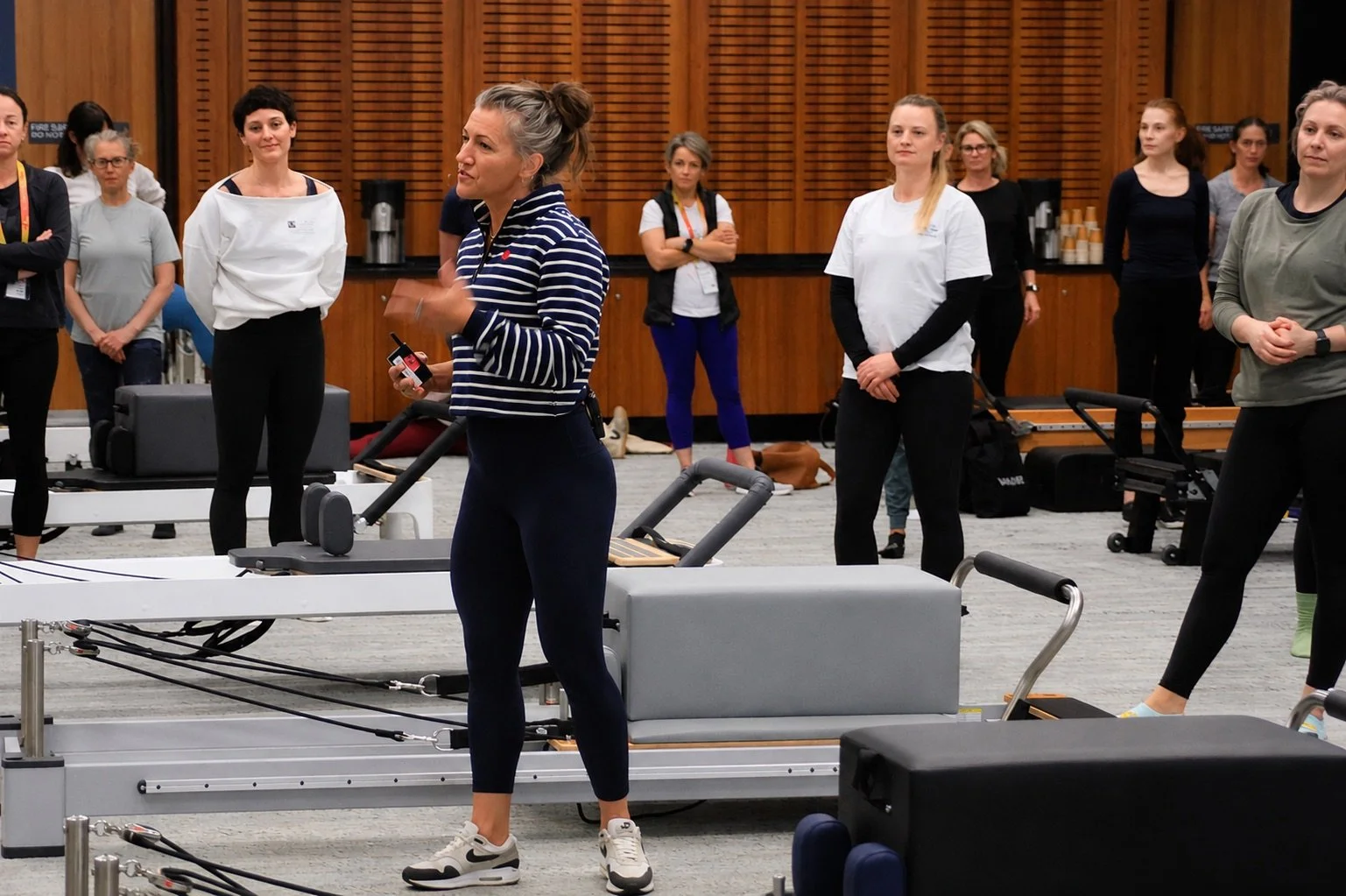 Cody Jussel teaching a Pilates instructor workshop in a studio setting