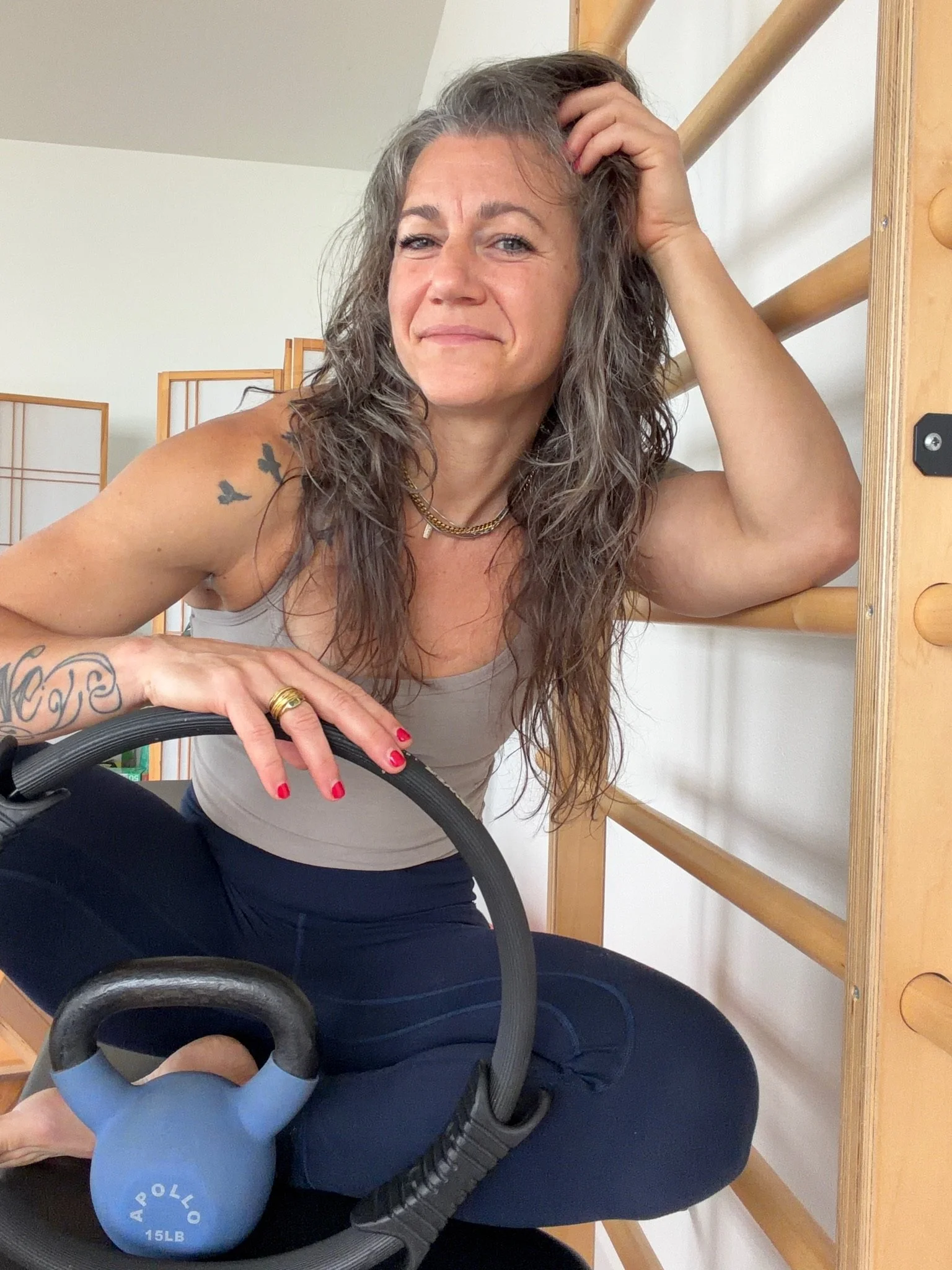 Cody Jussel, founder of Anatomy of Pilates and Pilates educator with a Master's in Kinesiology, in her studio