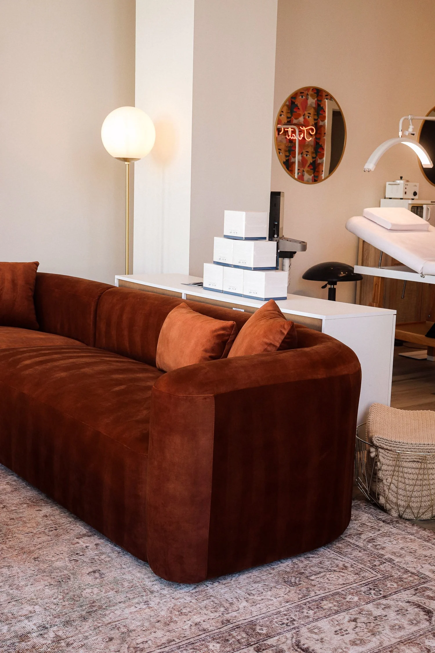 Rust velvet sofa in the lounge area