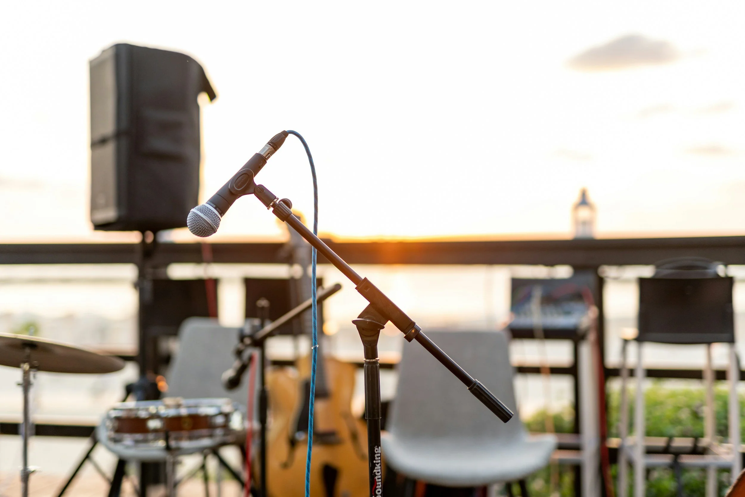Savannah Cerizo of Luna Solis Live outdoor stage venue microphone set up.