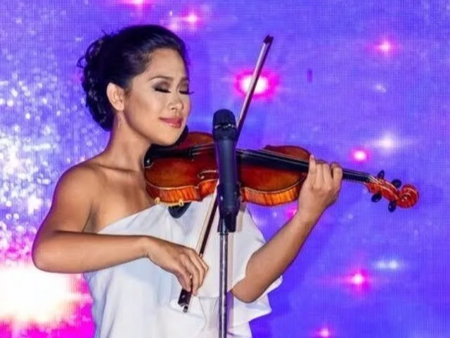 Savannah Cerizo of Luna Solis Live playing in the talent competition of the Miss Filipina Teen International beauty pageant in Redondo Beach, California.