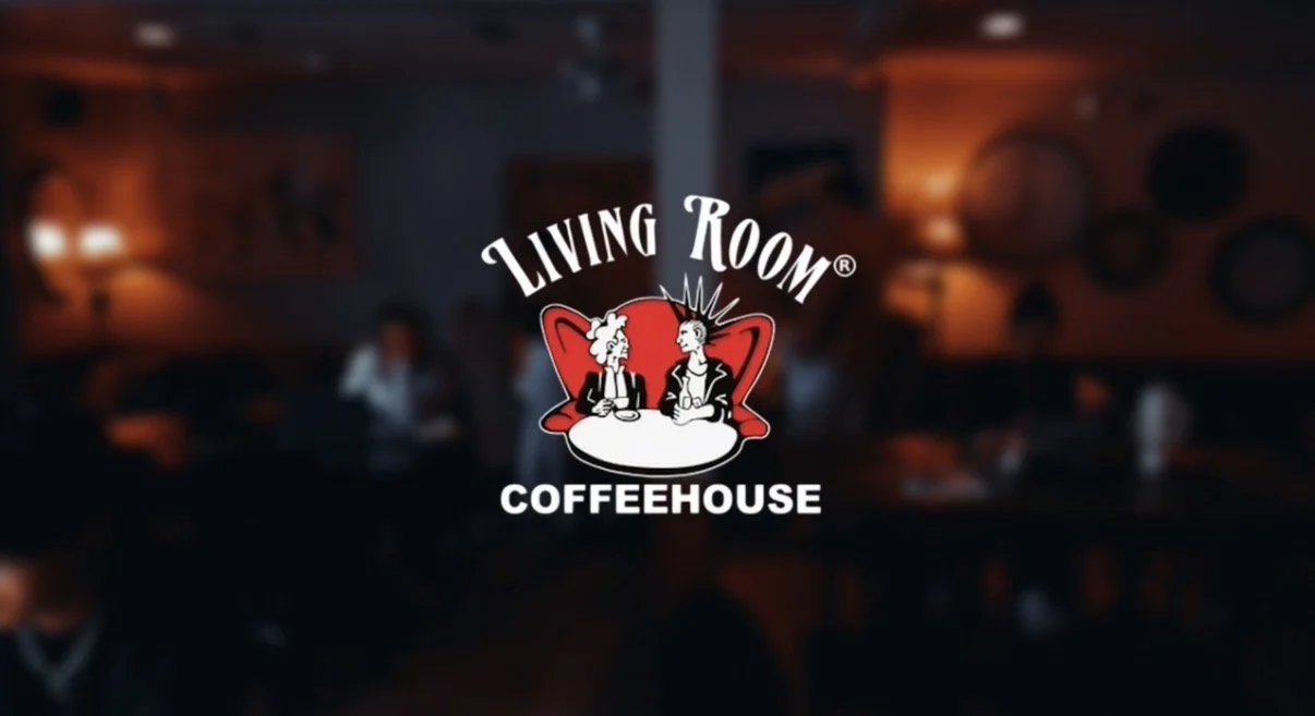 two cartoonish characters sitting at a cafe