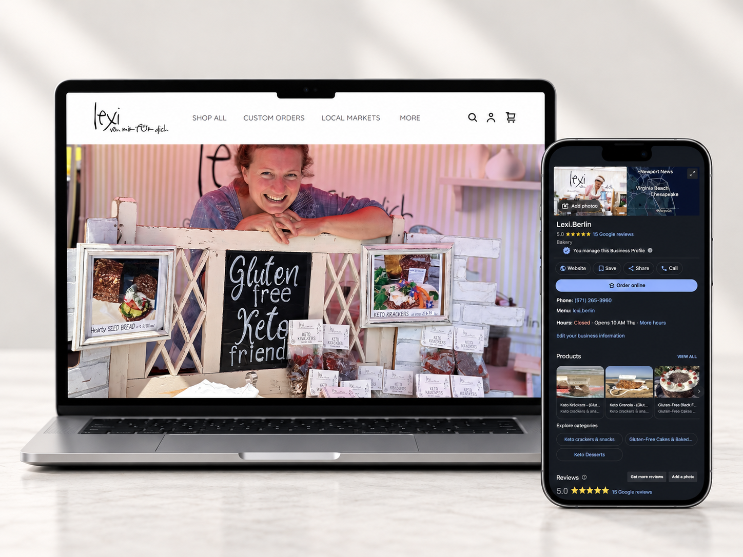Laptop and smartphone displaying a bakery's website and profile. The website shows a woman smiling at her gluten-free bakery stand with products and signs, including one reading 'Gluten free Keto friends'. The phone screen shows the bakery's Google profile with reviews, contact info, and product images.