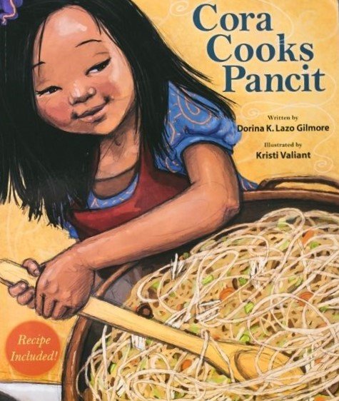 Book cover titled 'Cora Cooks Pancit' showing a girl with long black hair cooking noodles in a pan.