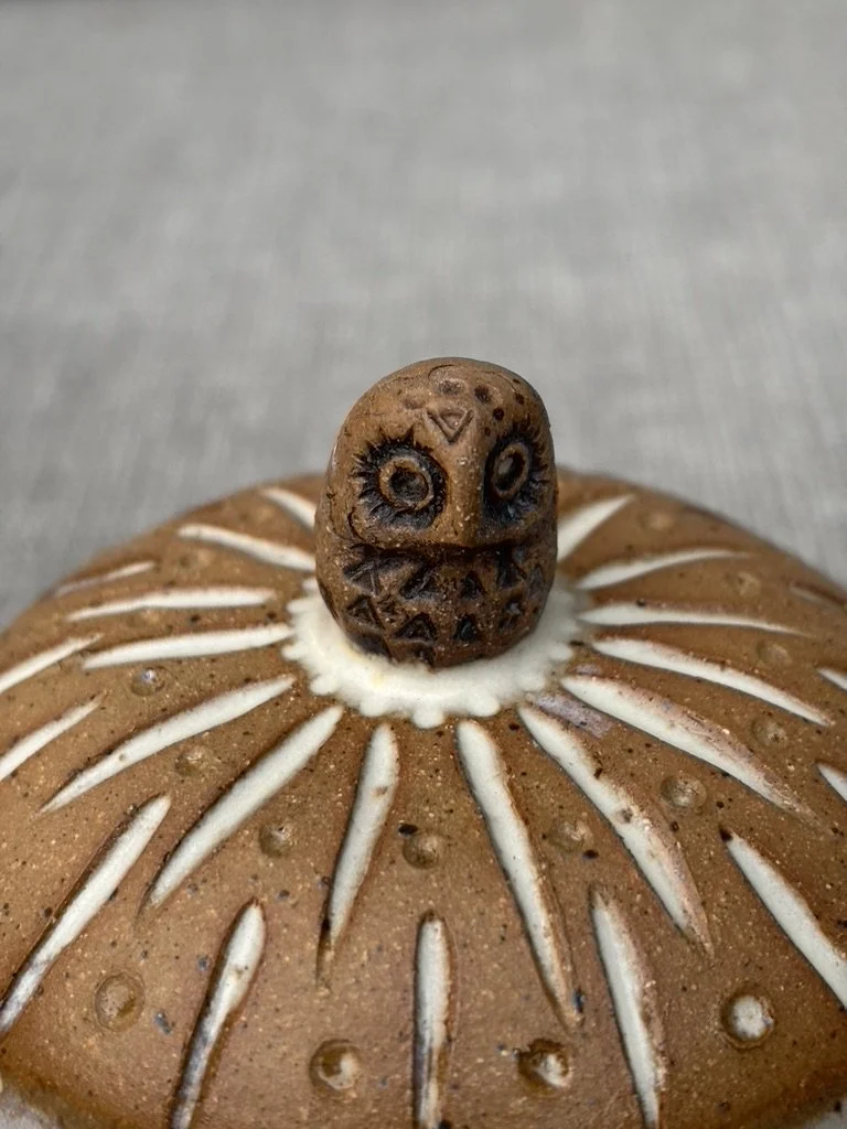 Close-up of ceramic butter dish with owl made by Radiomud,