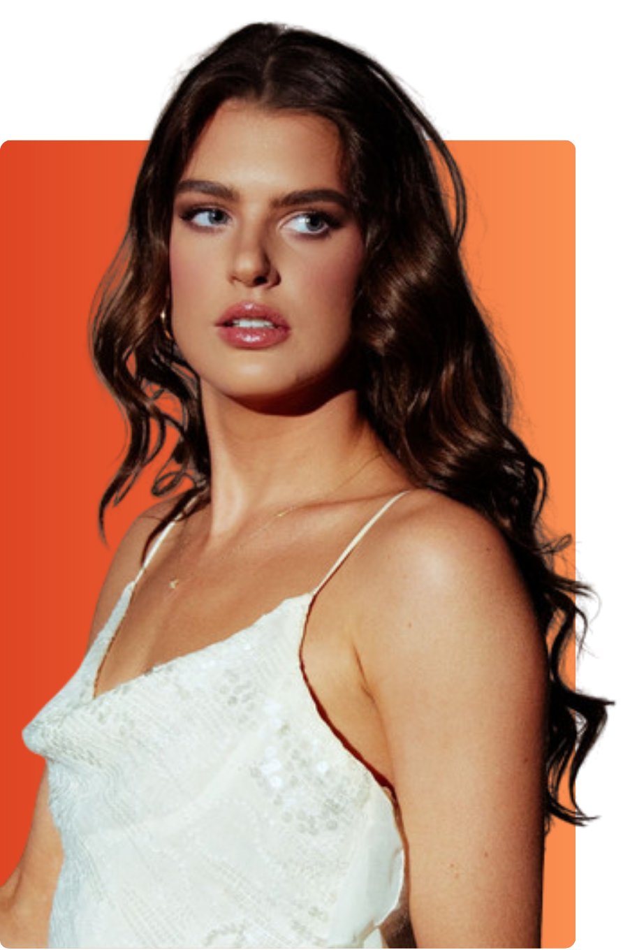 Portrait of Nashville country artist Grace Gunn in white dress against orange backdrop