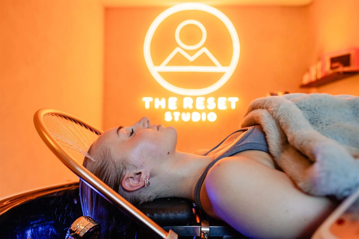 Guest relaxing under the water halo during a YUME Japanese head spa at The Reset Studio, Pure Senses, Cromwell