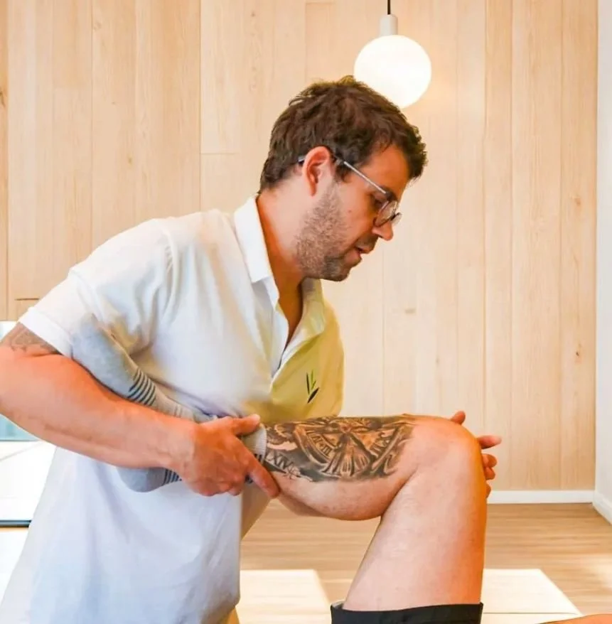 Osteopath treating a patient's knee, Osteopathy Central Otago at Pure Senses