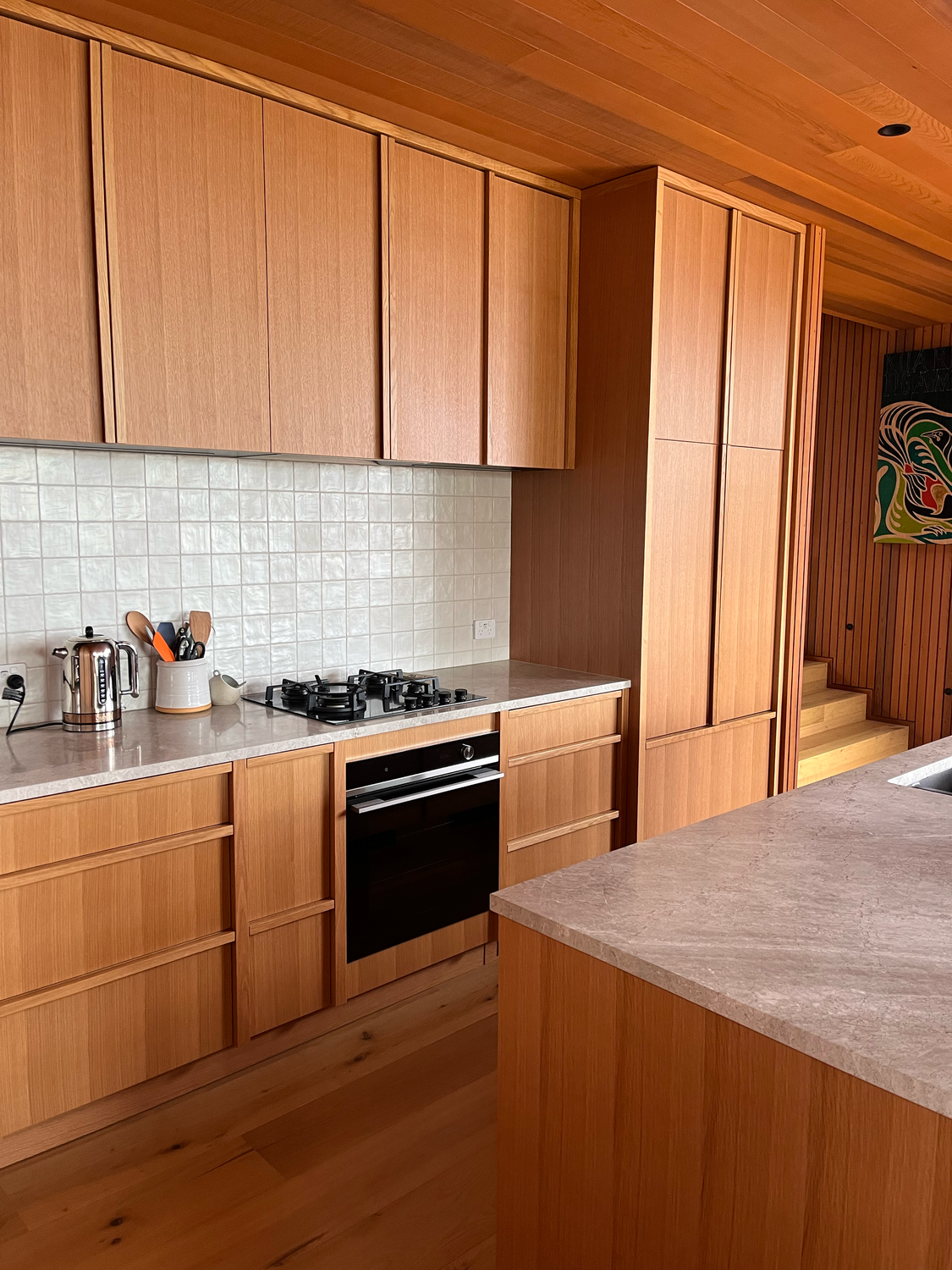 Oak Kitchen with integrated appliances and moulded oak handles / Kūaotunu, 2025.