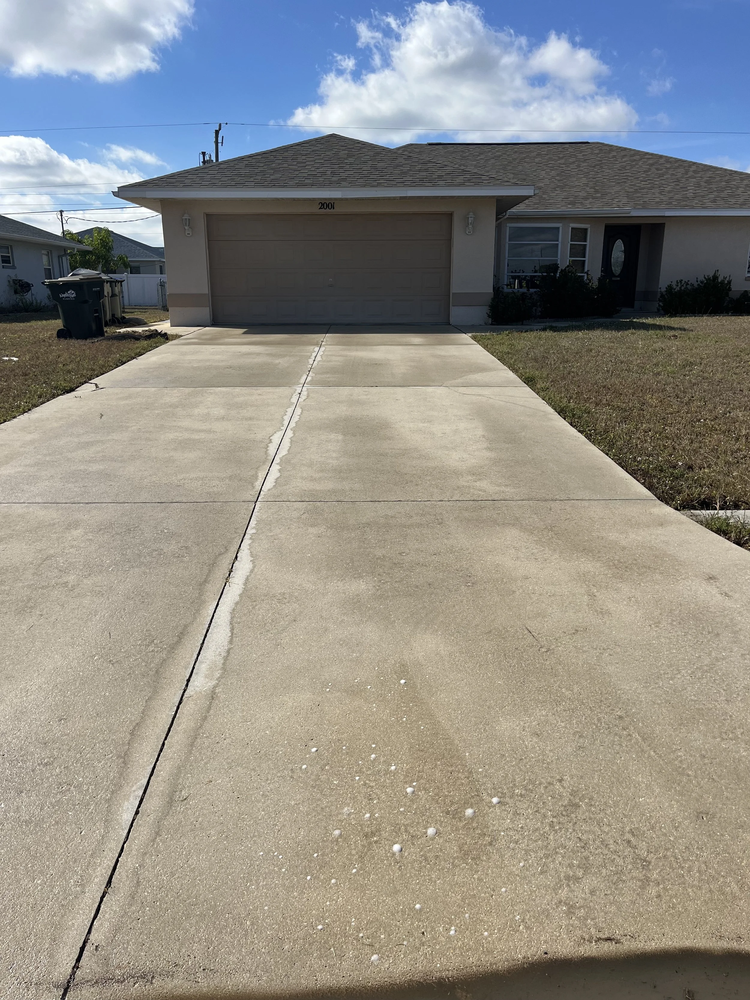CLEANED DRIVEWAY WITH PRESSURE WASHER