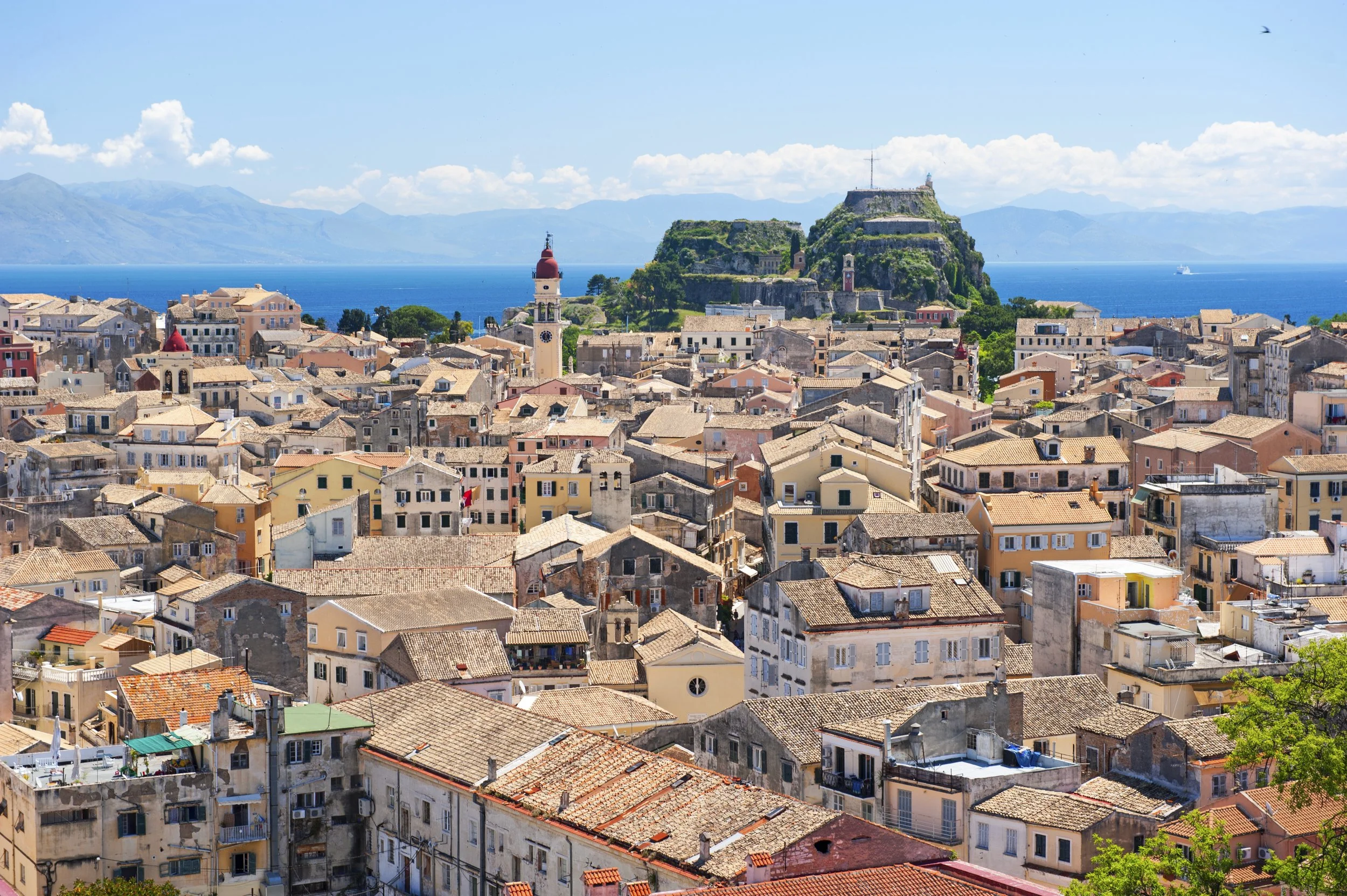 Panoramic view of Corfu Old Town, a UNESCO World Heritage Site, overlooking the Ionian Sea.