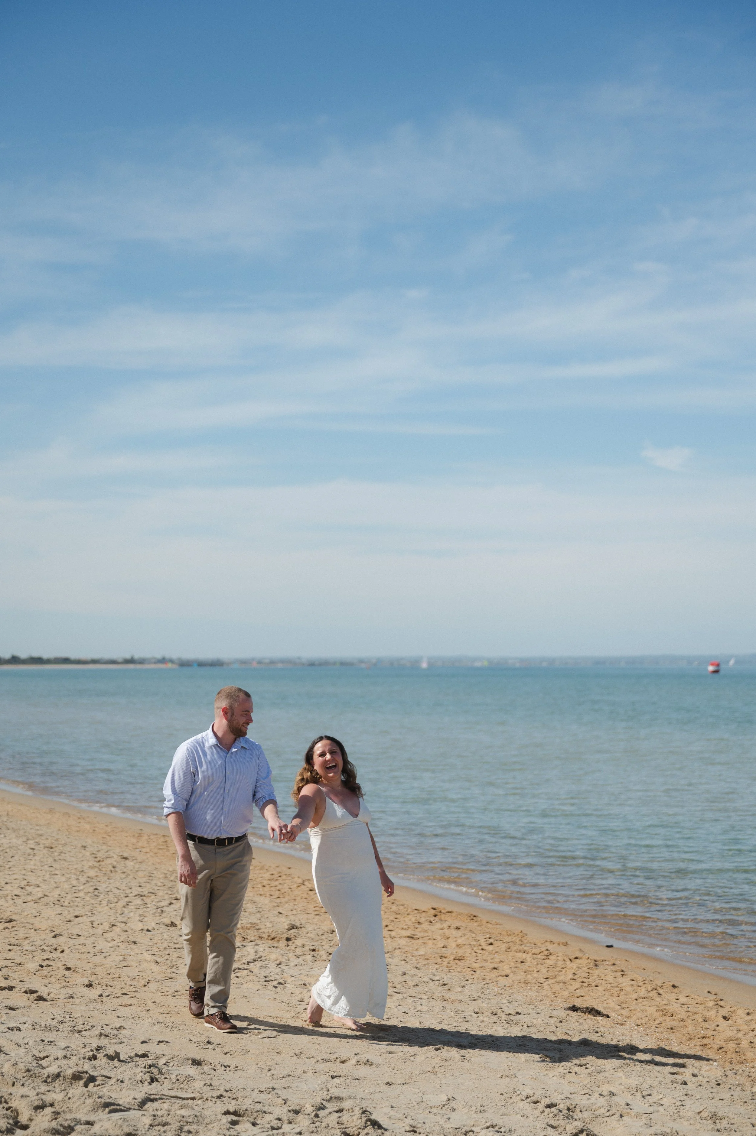 Laurie’s customers, Fernando and Kate embracing by the lake on their wedding day.