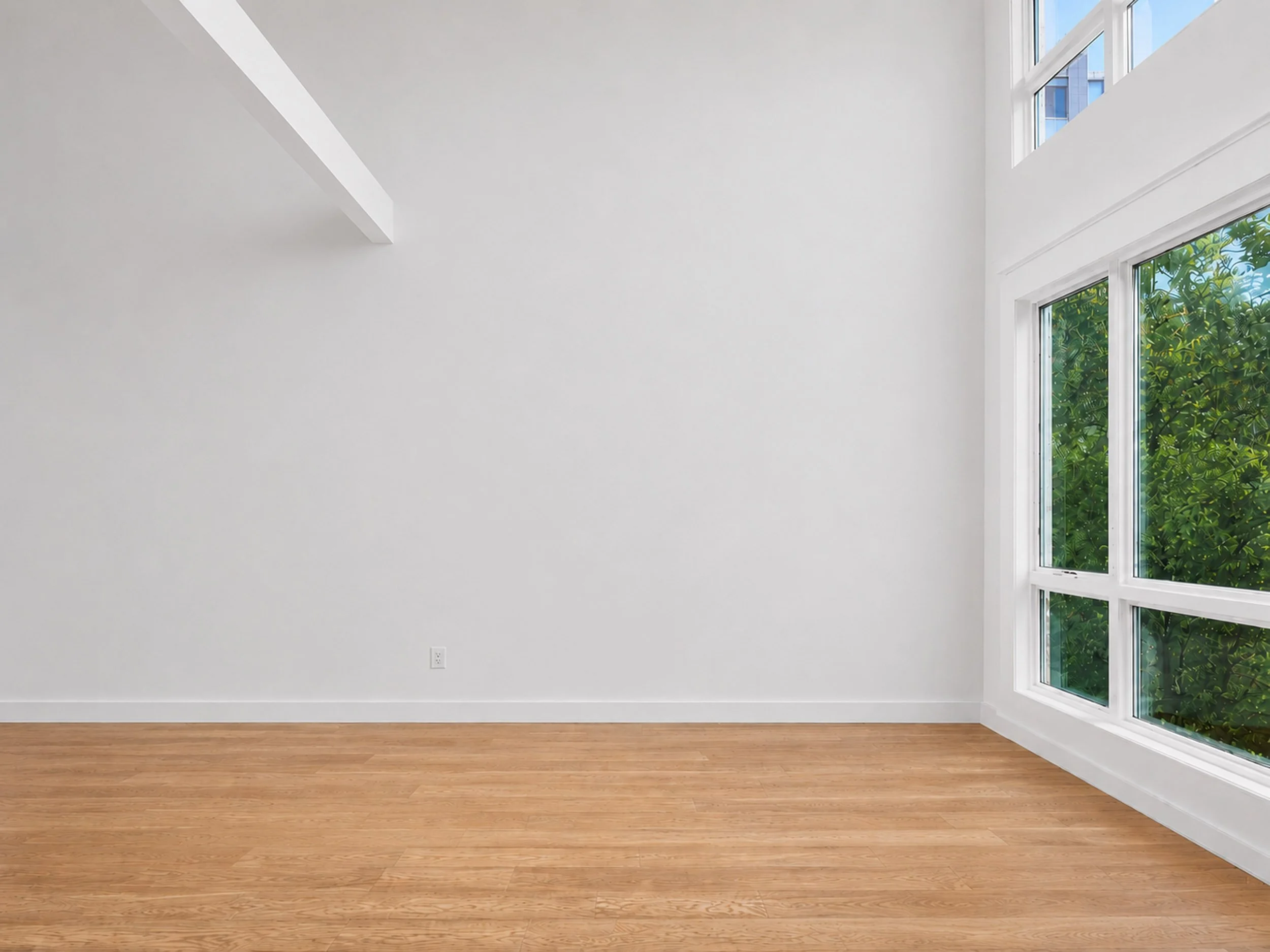 The double-height living room before the design — white walls, exposed beam and oak floors