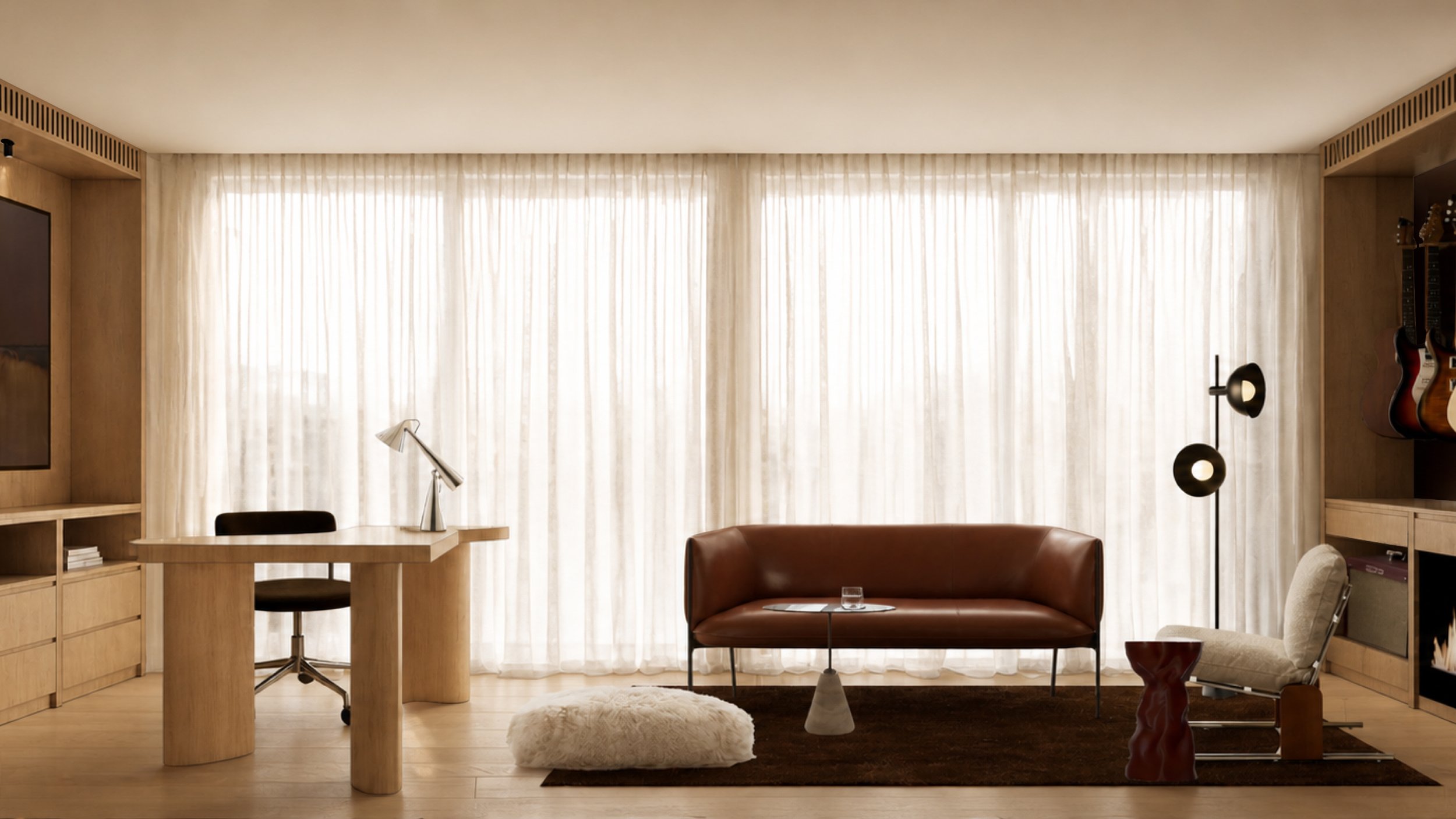 Music room with guitar wall, gas fireplace, bar shelving and tan leather chairs on a brown rug