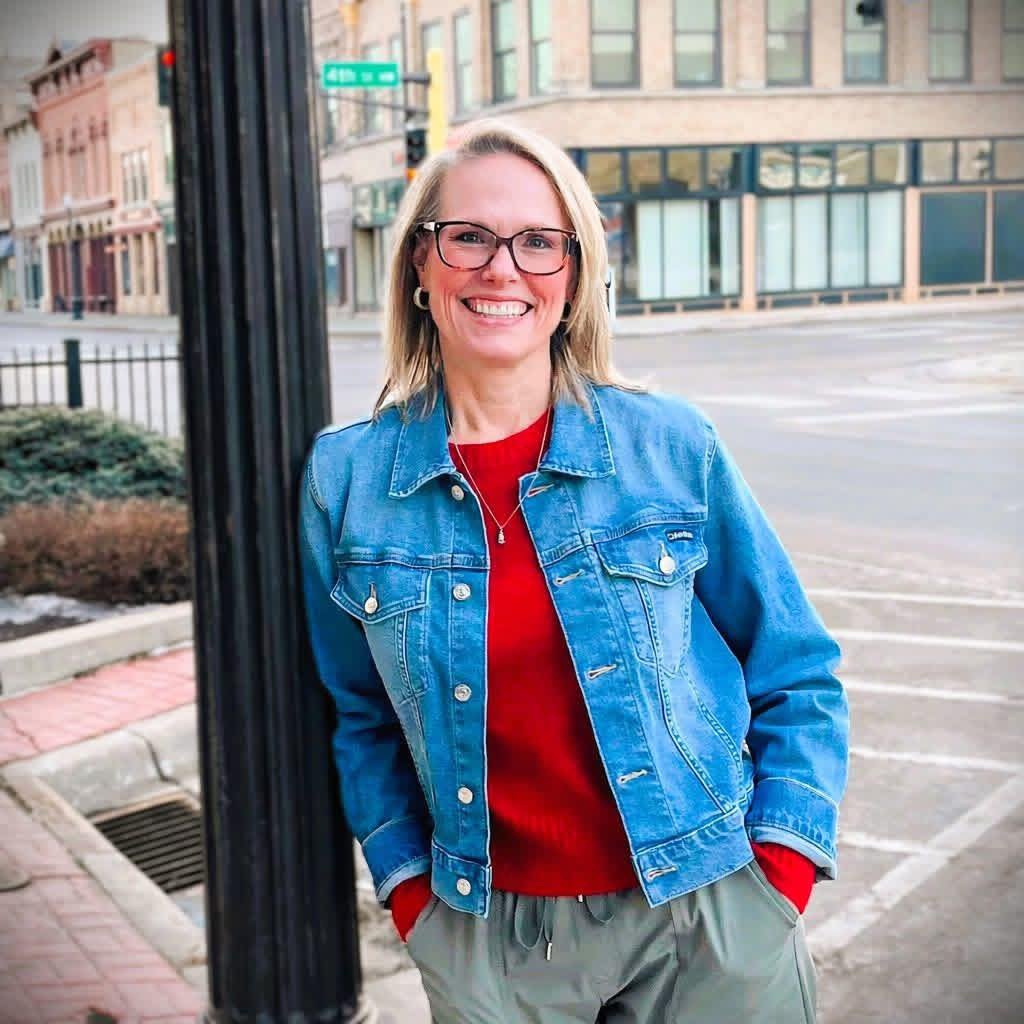 Photo of Natalie Halverson standing in downtown Faribault.