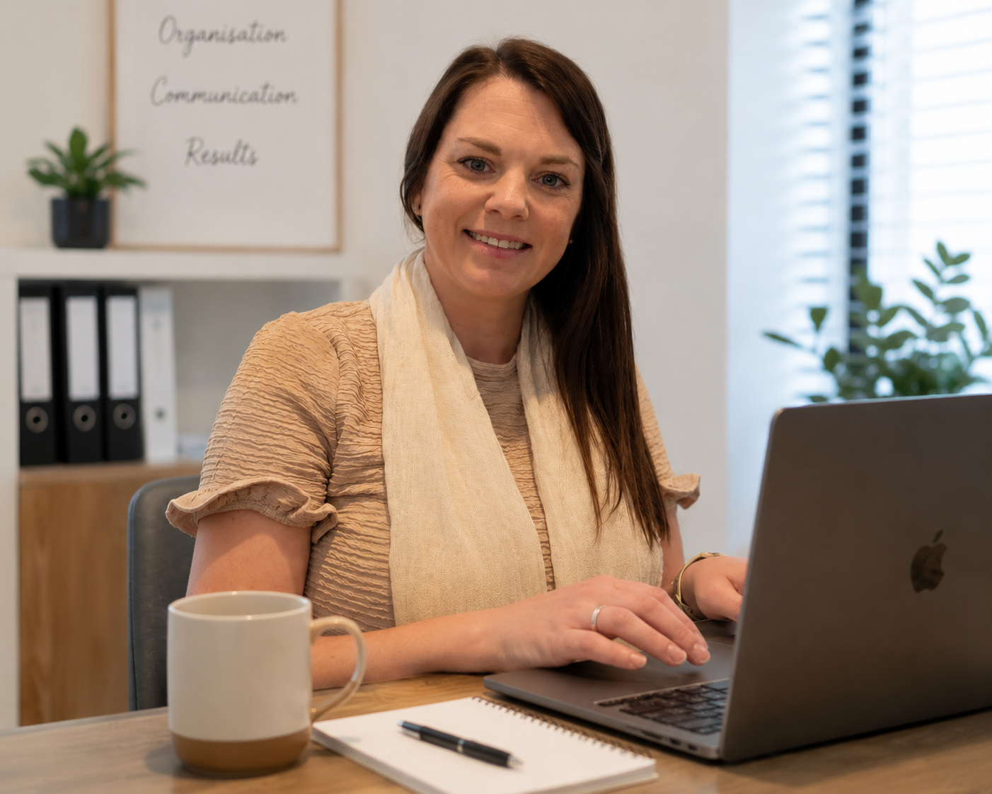 A virtual assistant sitting at her desk ready to work in property management support, property management inspections and tradie admin support