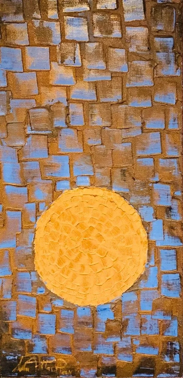 Painting of a brick wall with a large, textured yellow circle in the center, some blue accents on the bricks.
