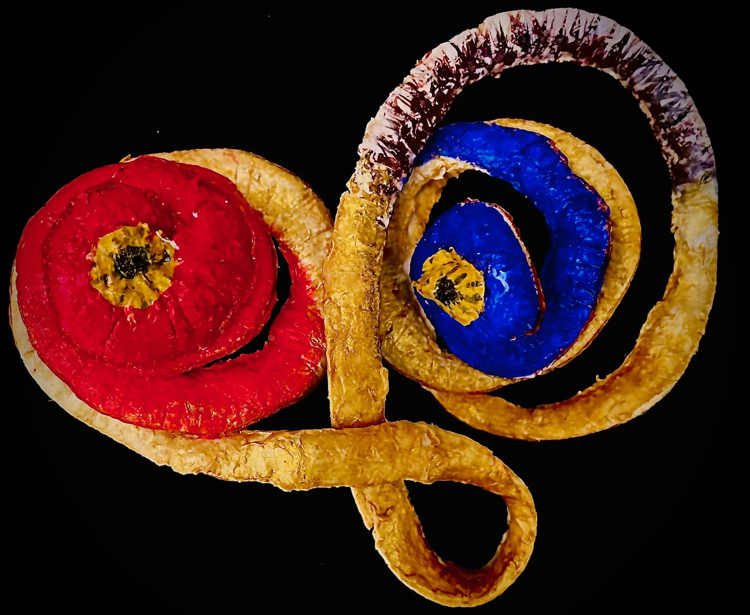 Colorful citrus rinds on a black background.