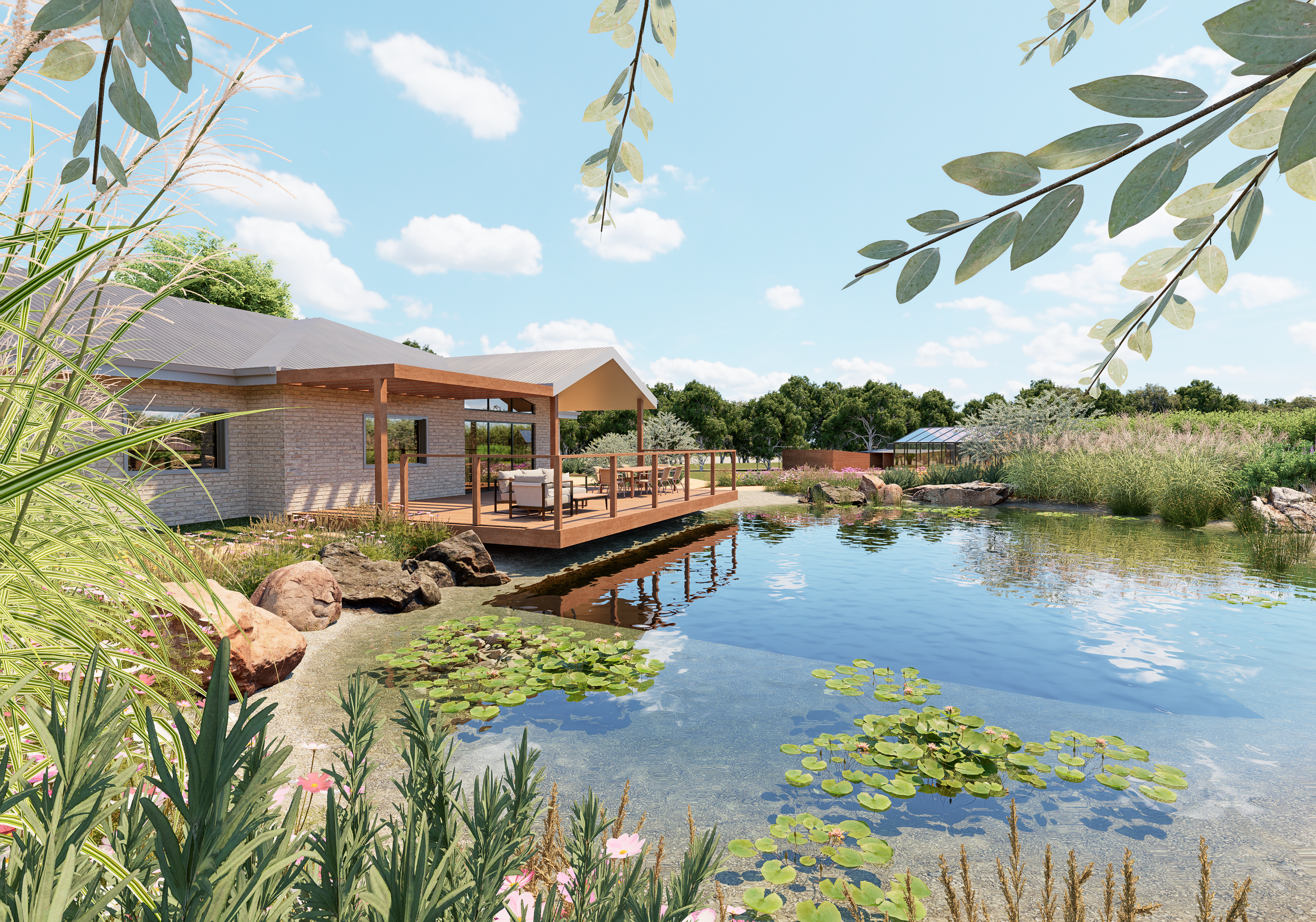 A peaceful backyard scene with a pond surrounded by plants, rocks, and water lilies, a house with a deck, outdoor furniture, and a clear blue sky with a few clouds.