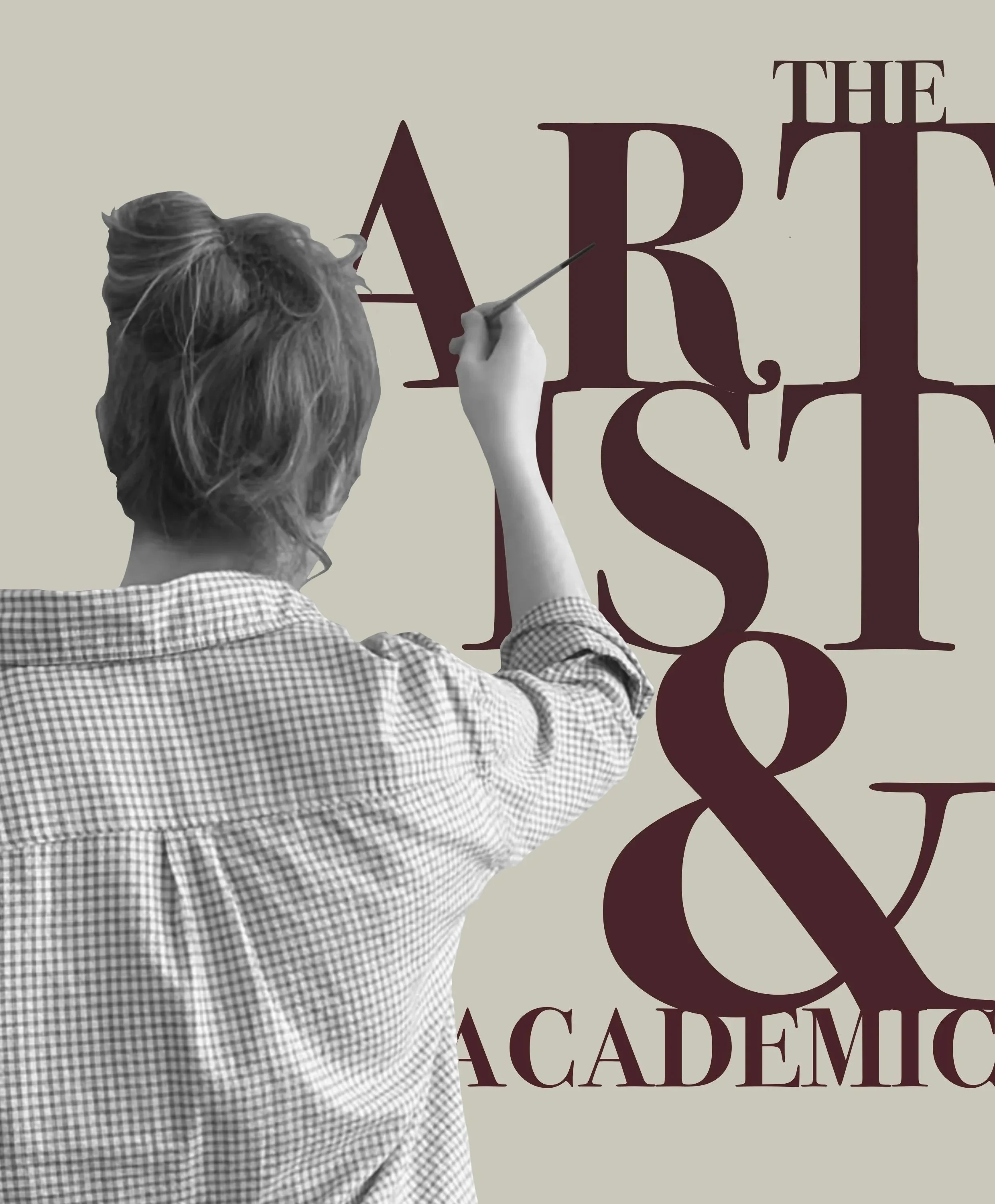 Black and white photo of woman wearing a checked shirt, painting the words "The Art of Academic" in burgundy on a grey-green surface.