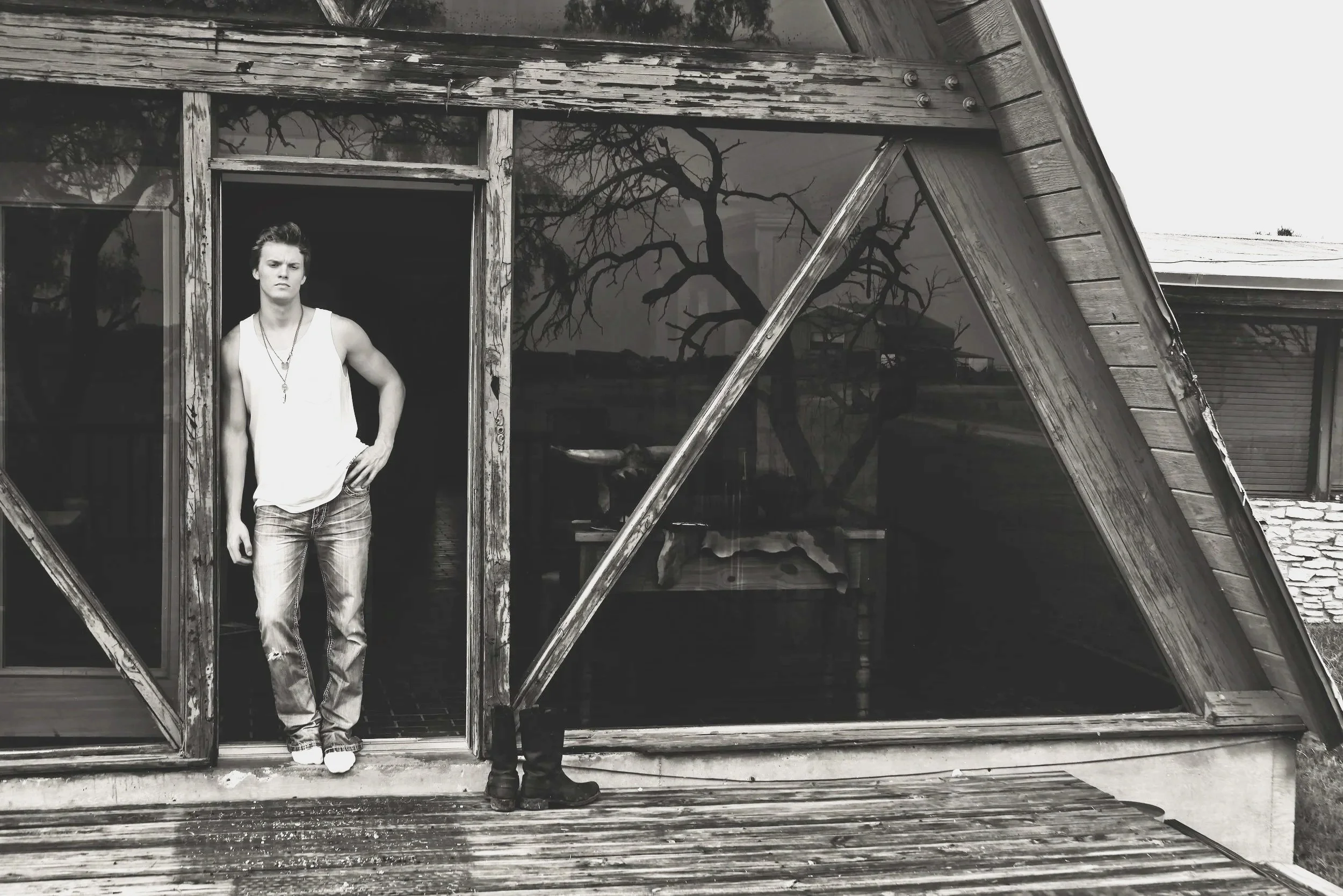 Parker McCollum at his family ranch during a portrait session for The Limestone Kid album. Black-and-white music photography documenting the early career of the Texas country artist.