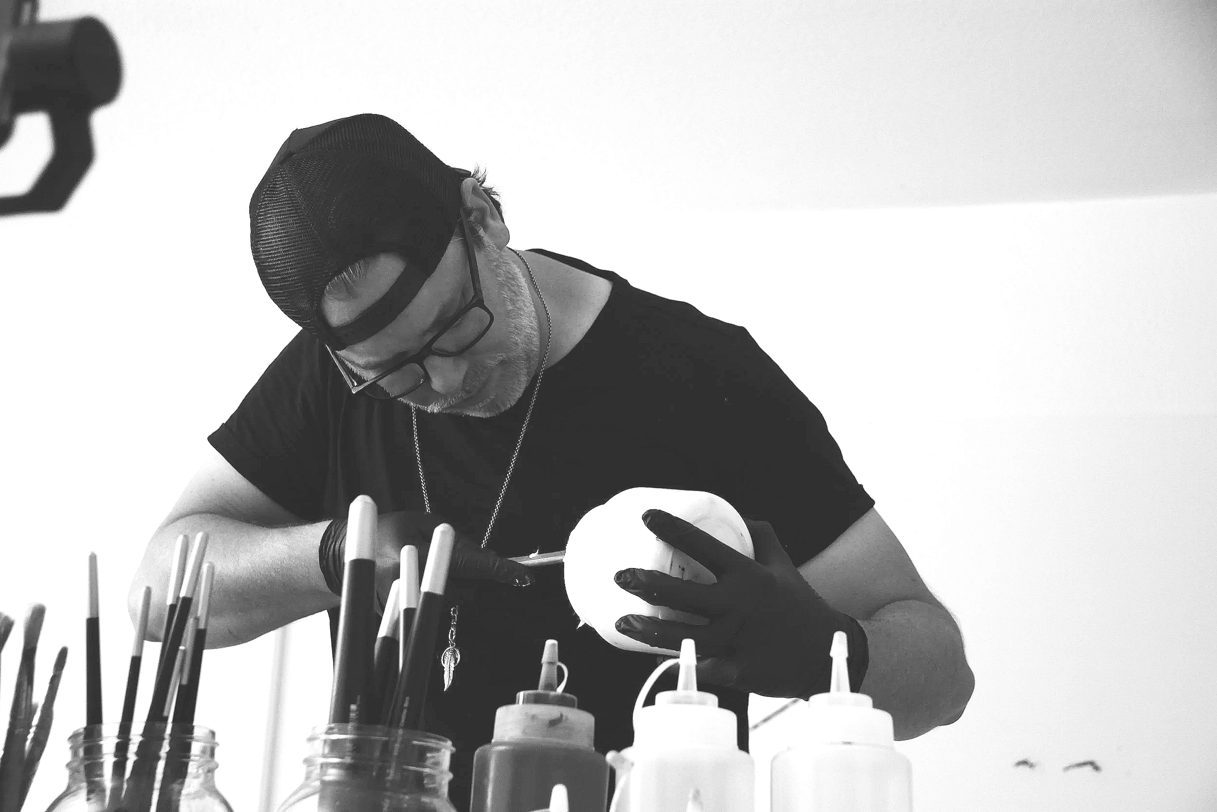 Christopher Durst preparing materials in his Austin studio before beginning a large-scale contemporary abstract painting.