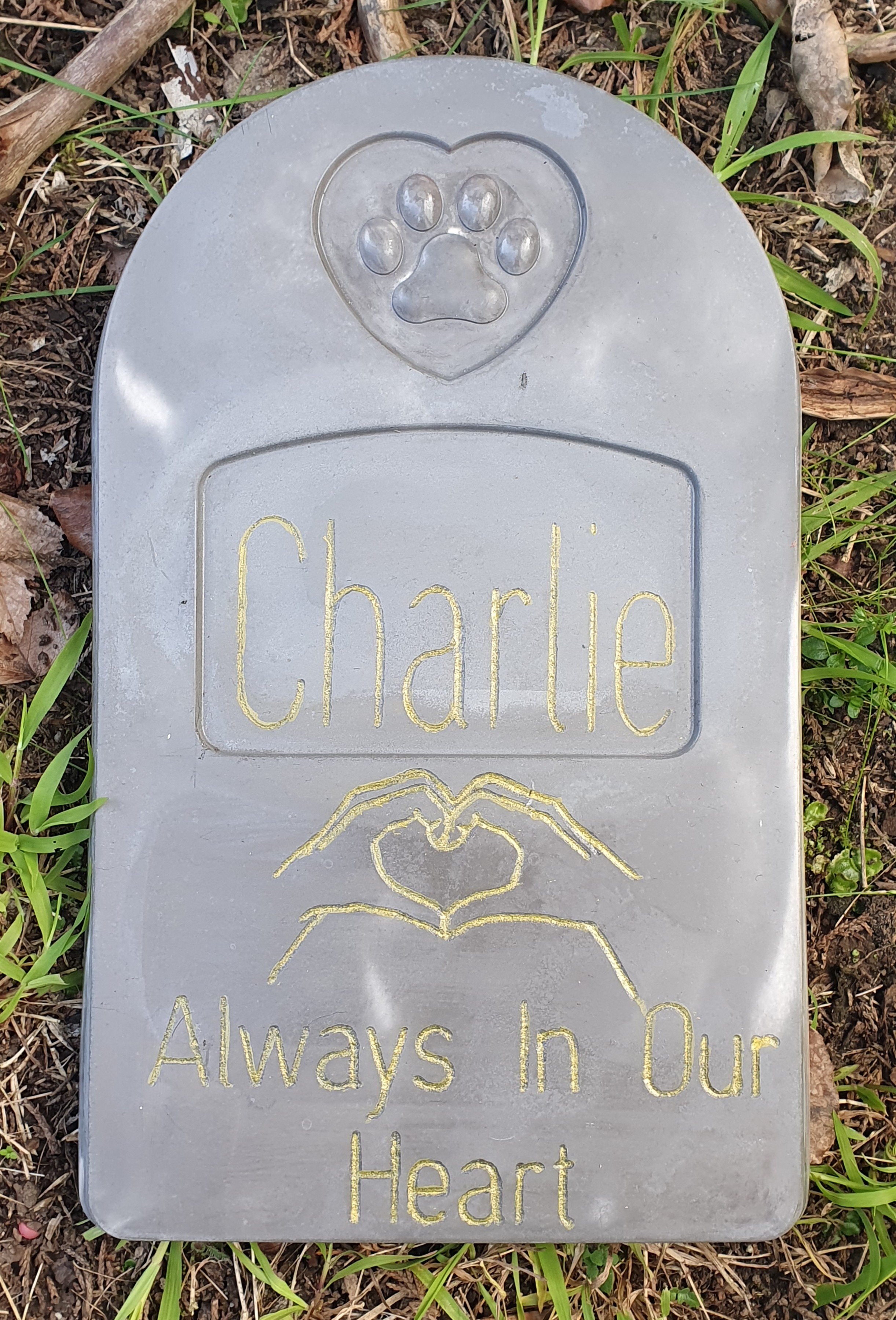 Engraved concrete pet memorial stone for a pet called Charlie.