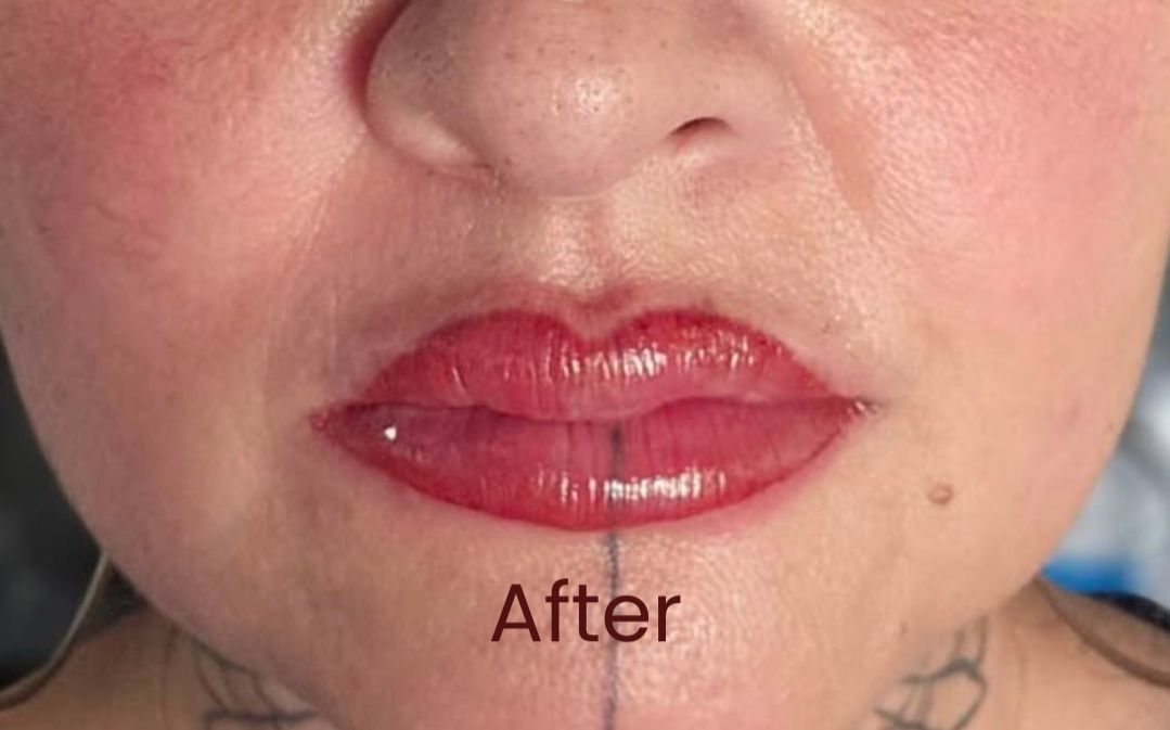 Close-up of a client's lips after undergoing her PMU lip treatment, with much fuller, brighter lips.