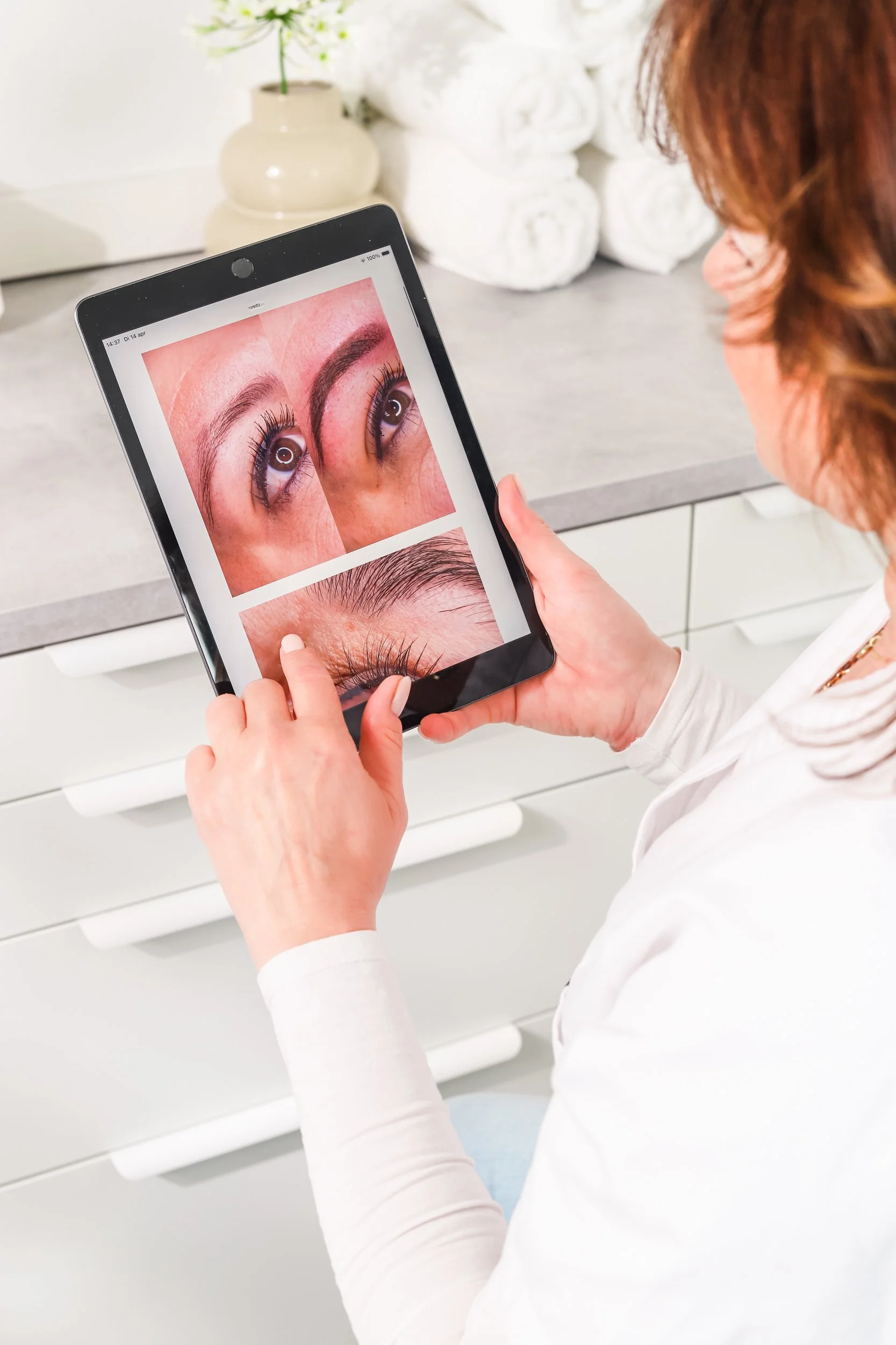 Chaja a permanent make-up artist is selecting the optimal eyebrow form for her PMU clients.