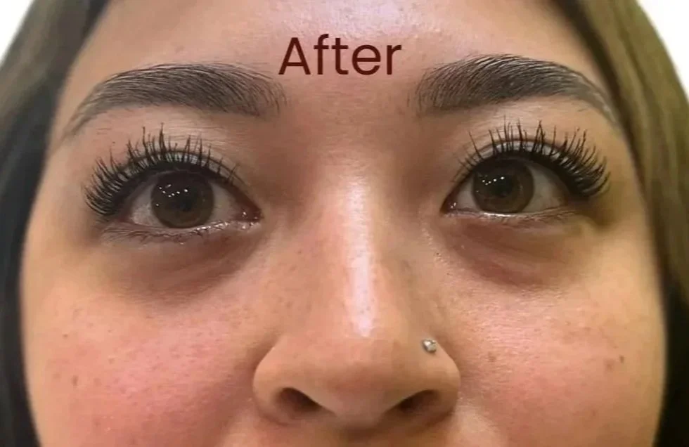Close-up of a woman's face after her eyebrow ombre or powder treatment, showing much more definition and structure.