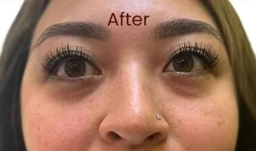Close-up of a woman's face after her eyebrow ombre or powder treatment, showing much more definition and structure.