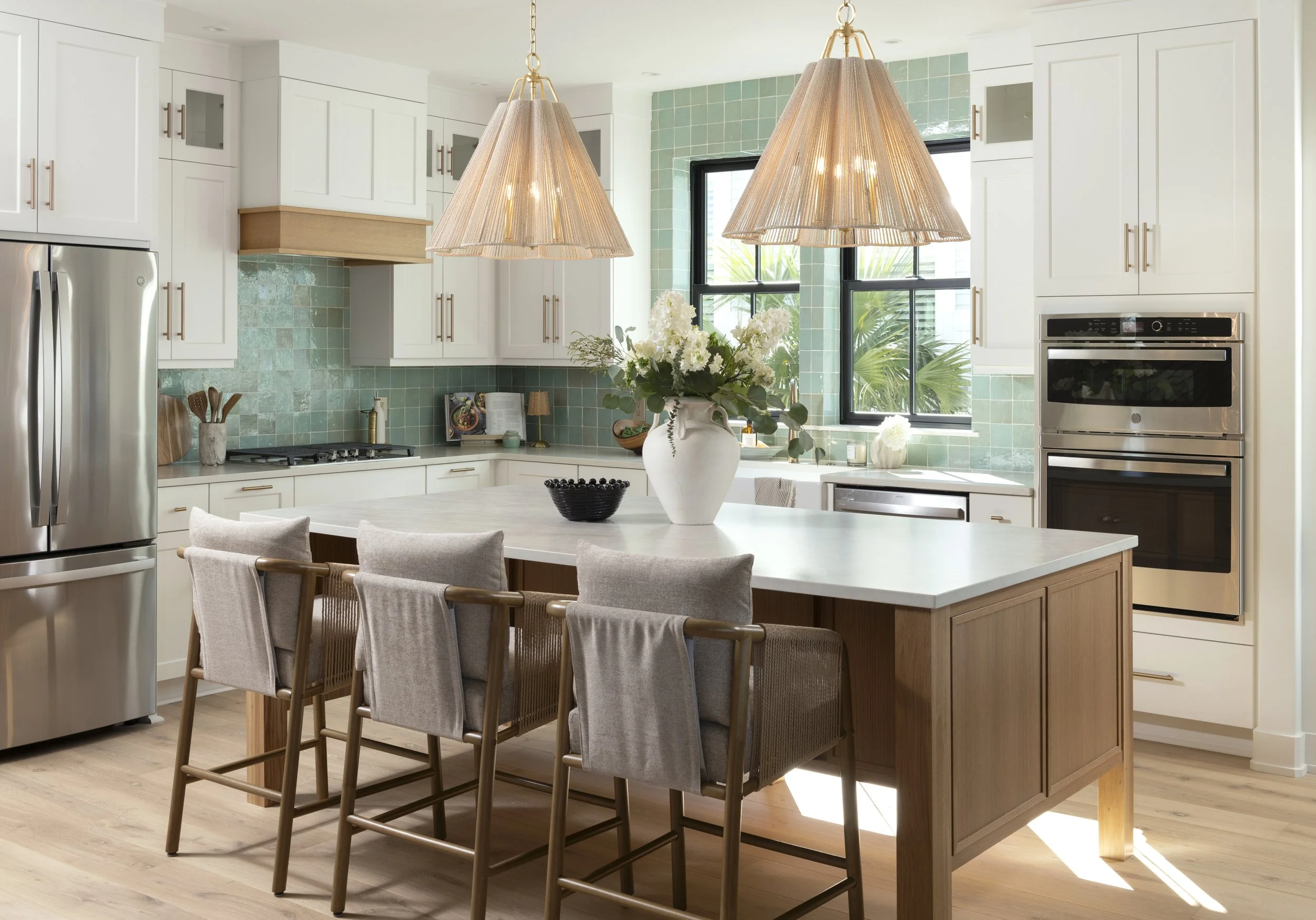 Open-concept kitchen designed for entertaining with custom millwork, oversized island, and seamless indoor-outdoor flow.