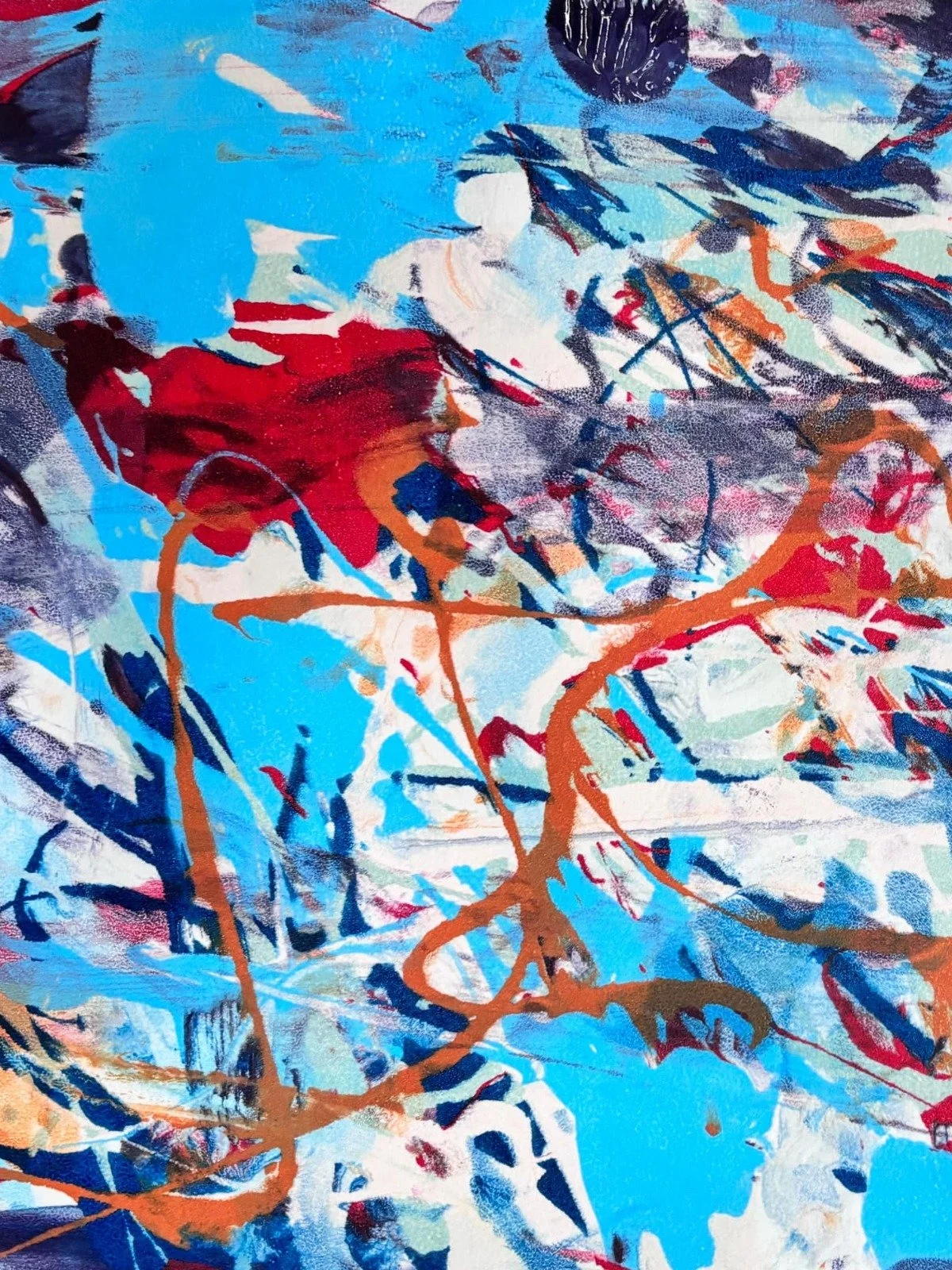 Abstract painting featuring blue, red, white, and black colors with dynamic brushstrokes and splashes.