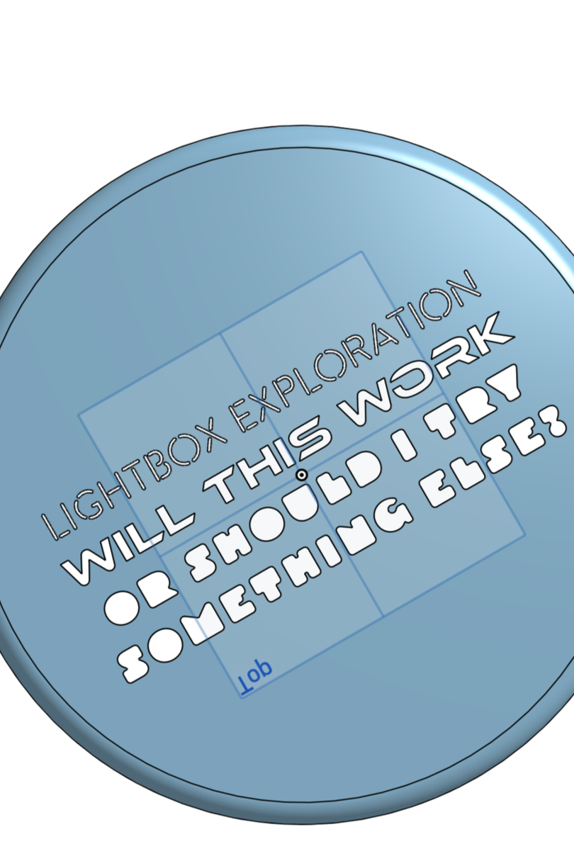 A round, metallic button with text that reads, "Lightbox Exploitation Will This Work or Should I Try Something Else?"