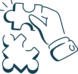 A hand holding and assembling puzzle pieces.