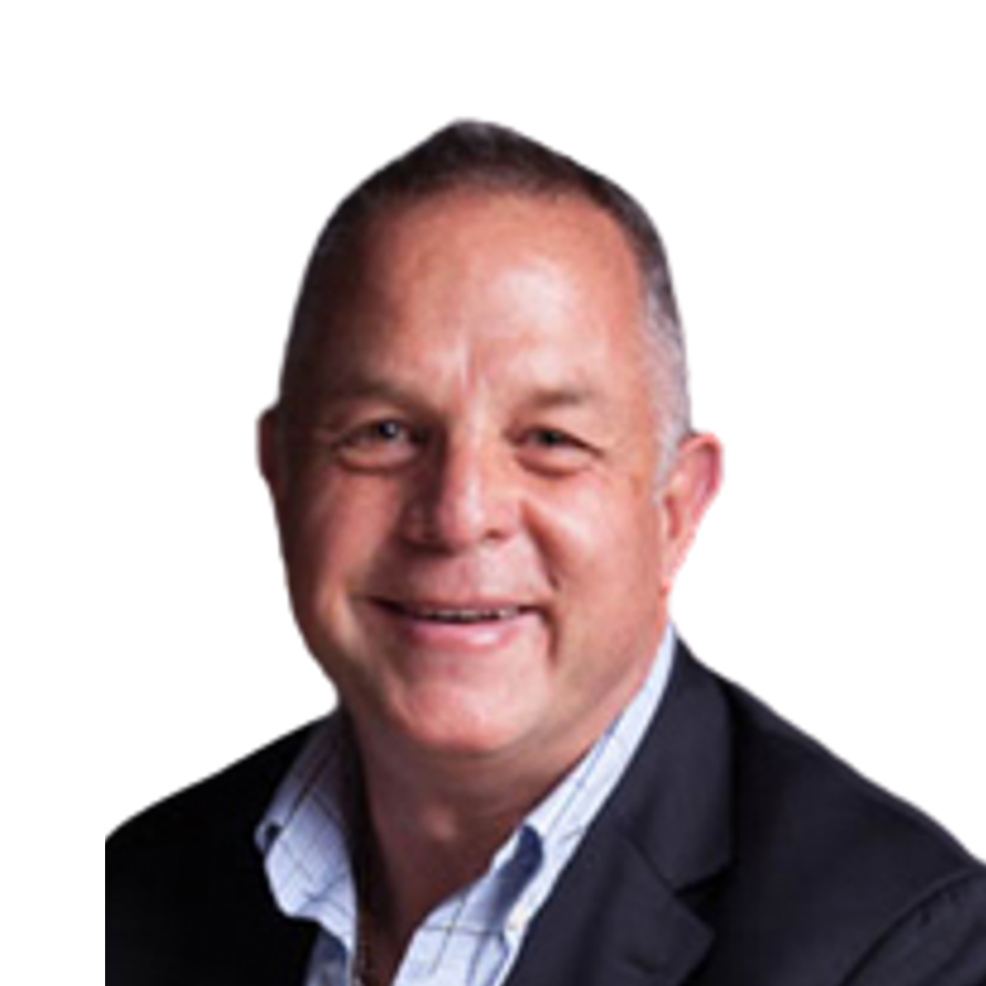 “Professional headshot of a smiling man with short dark hair, wearing a dark blazer over a light checked shirt.