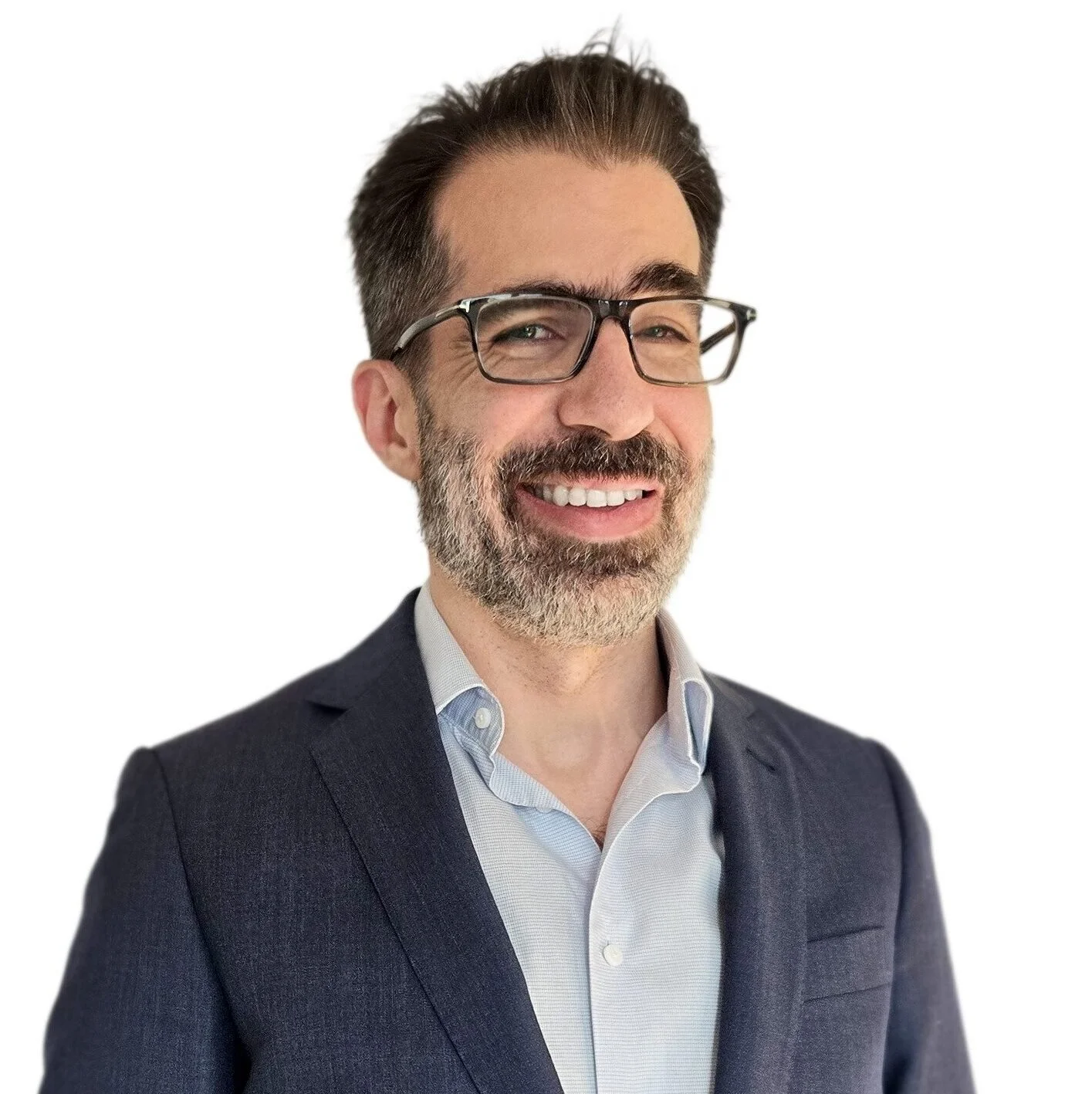 A man with a beard and glasses, displaying a genuine smile.