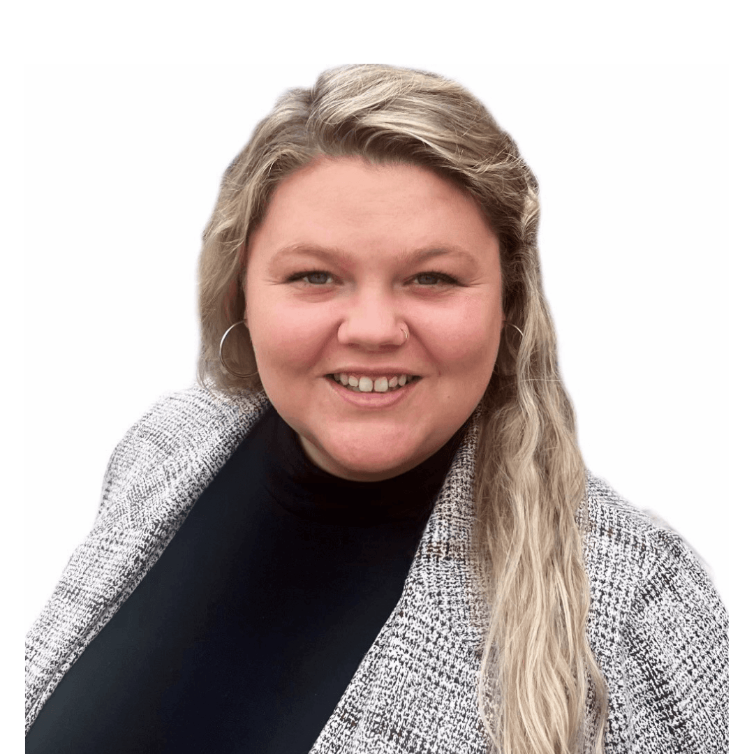 Professional headshot of a smiling woman with long blonde hair, wearing a black top and patterned grey blazer against a white background
